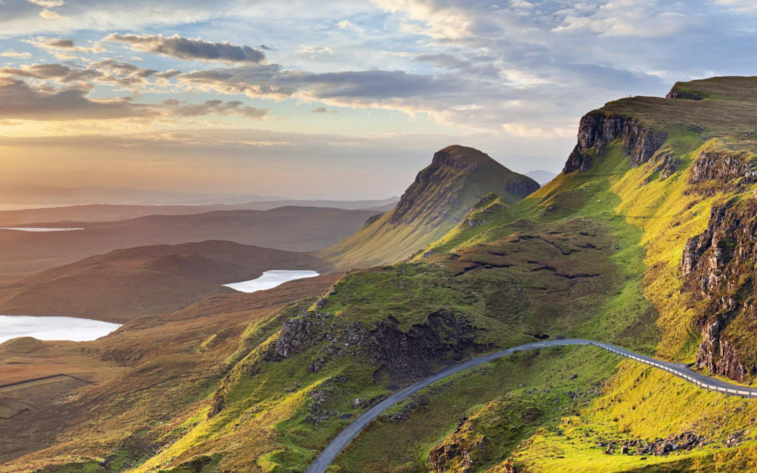 Scotland, winding road, vibrant green mountain slope, 2K Desktop Wallpaper