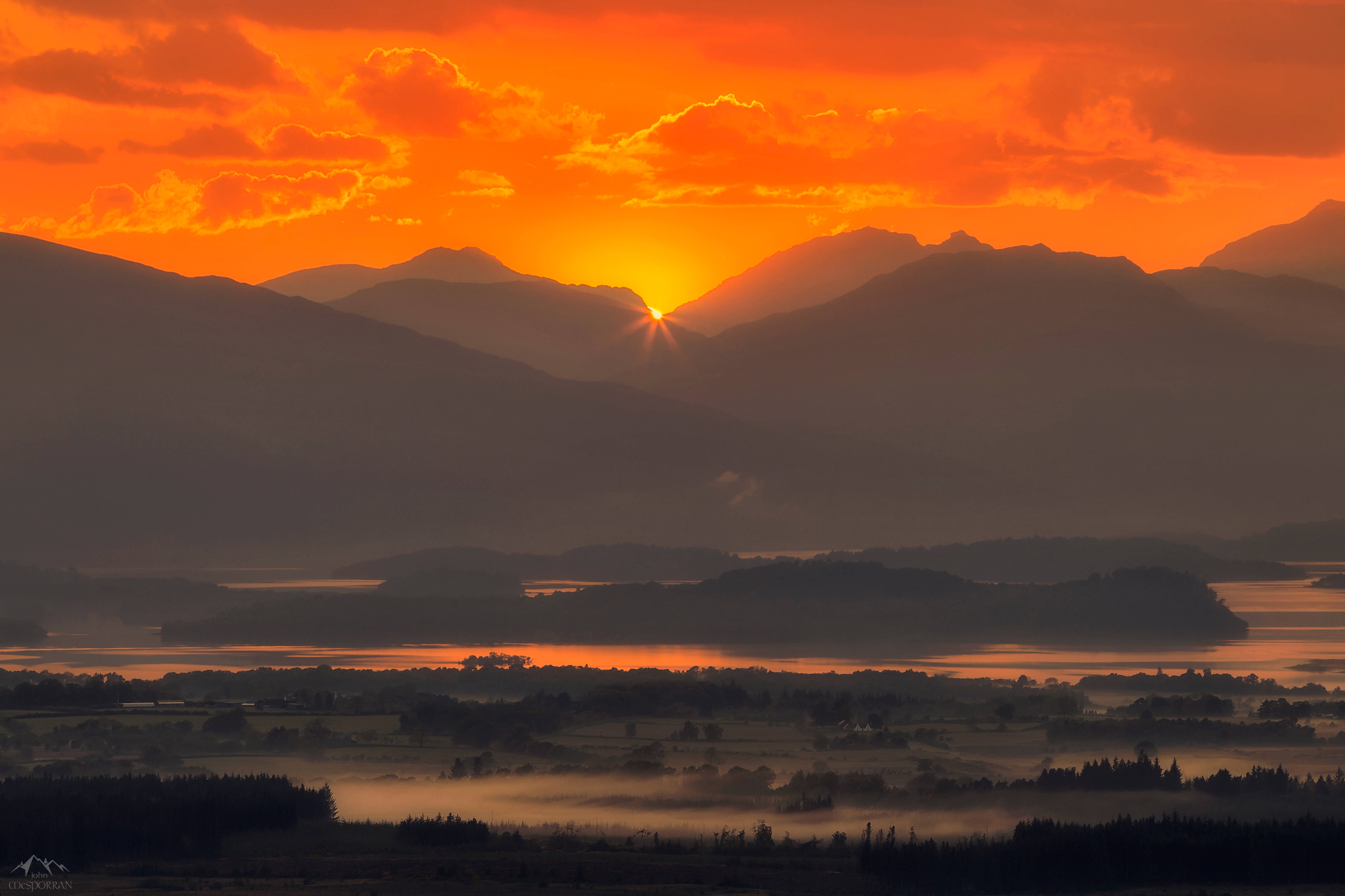 fiery orange sky, mountain peaks, misty lake, 8K Desktop Wallpaper