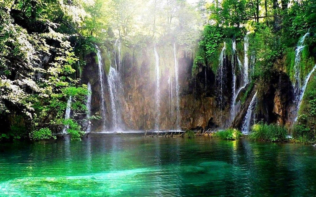 cascading waterfalls, sunlight, lush green trees, SD Desktop Wallpaper