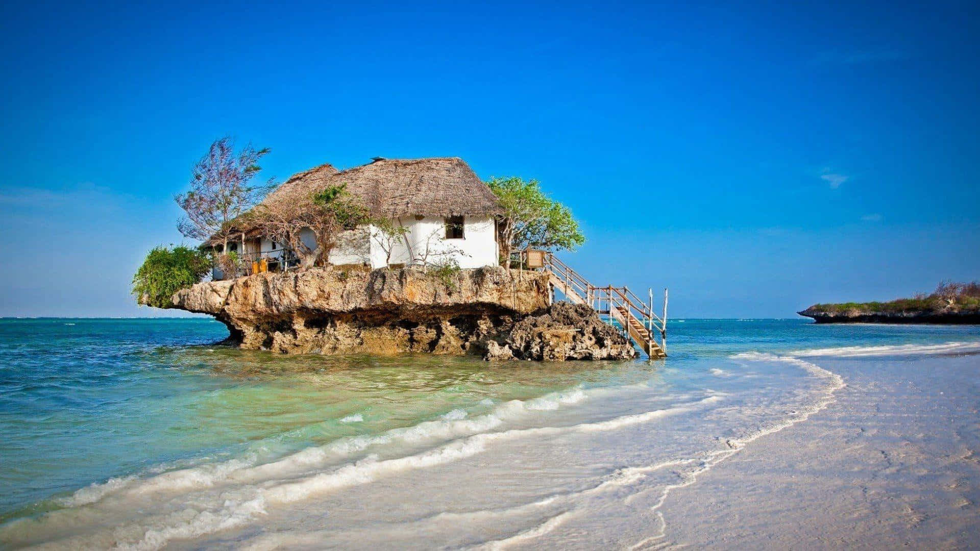 Seashore, thatched-roof hut, rocky outcrop, Full HD Desktop Wallpaper