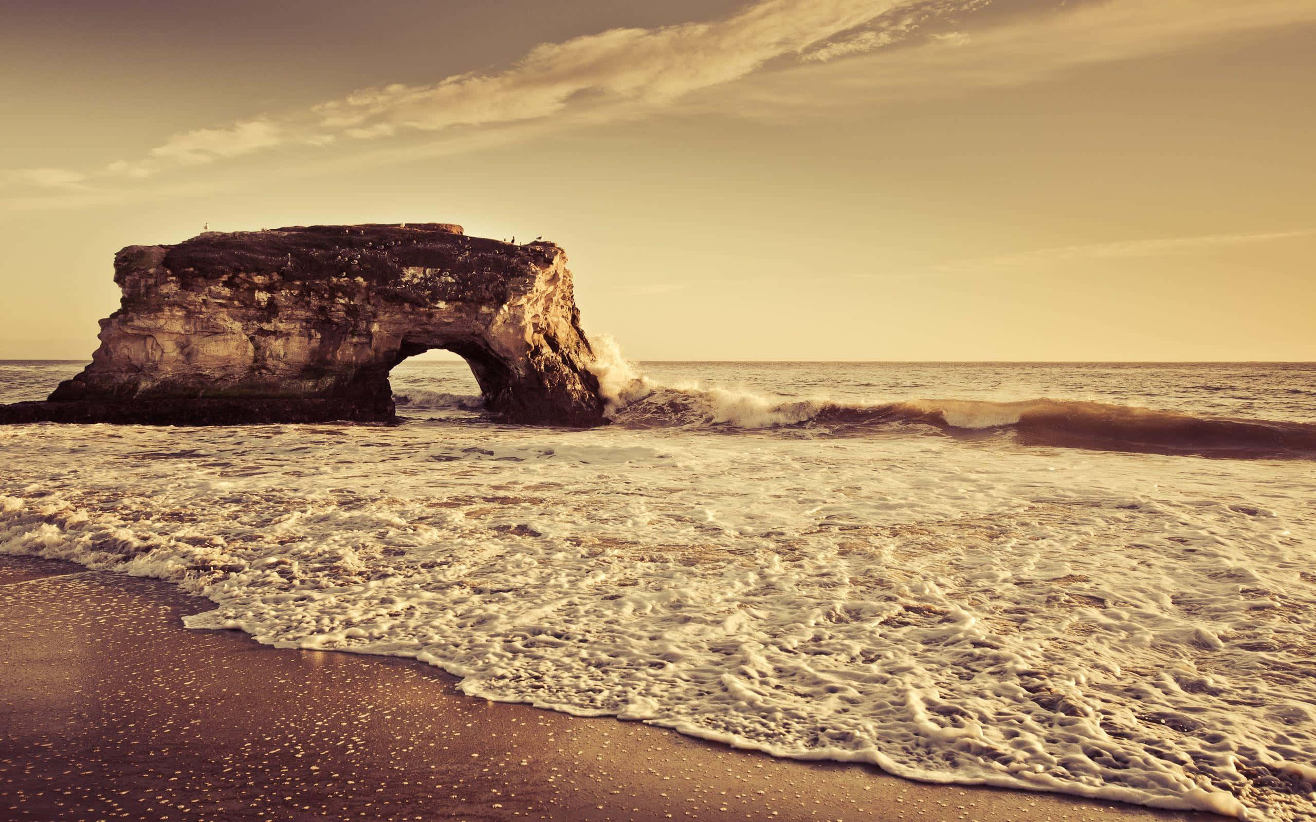 Seashore, golden sunset, rugged sea arch, 2K Desktop Wallpaper