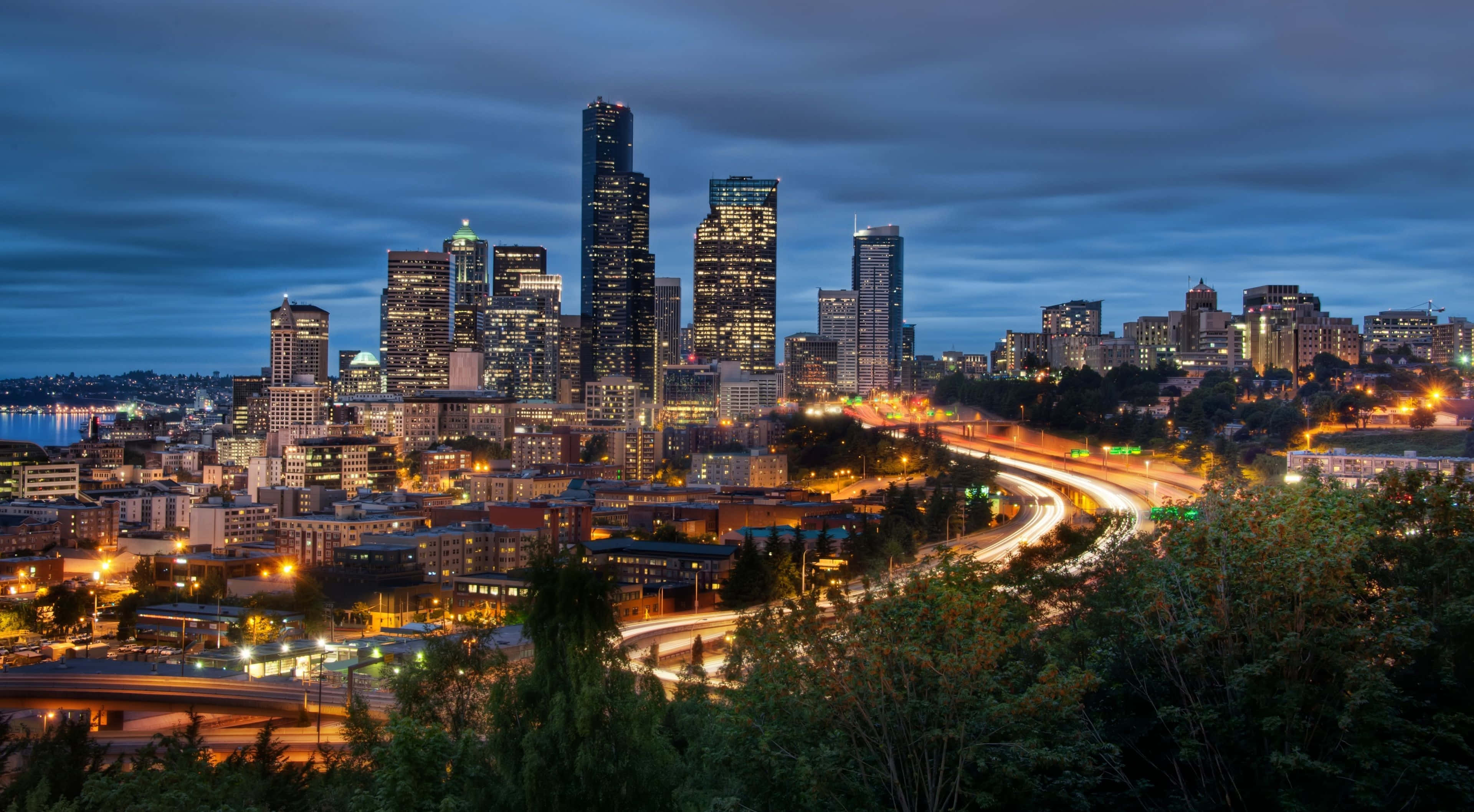Seattle skyline, dusk, glowing skyscrapers, 4K Desktop Wallpaper