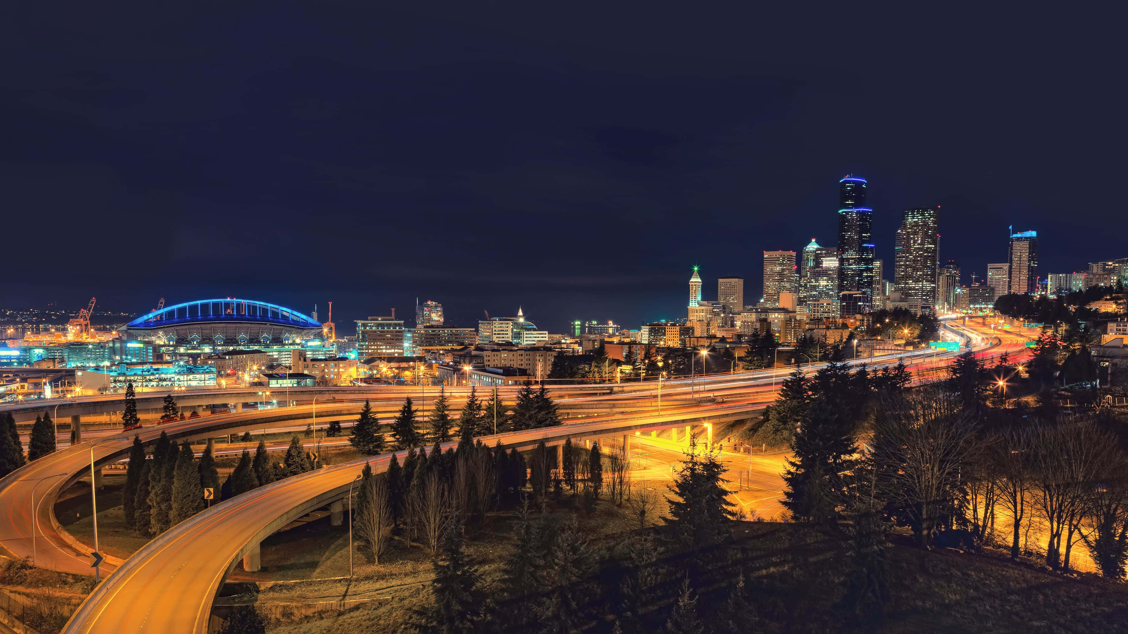 Seattle Washington, nighttime cityscape, glowing skyscrapers, 4K Desktop Wallpaper