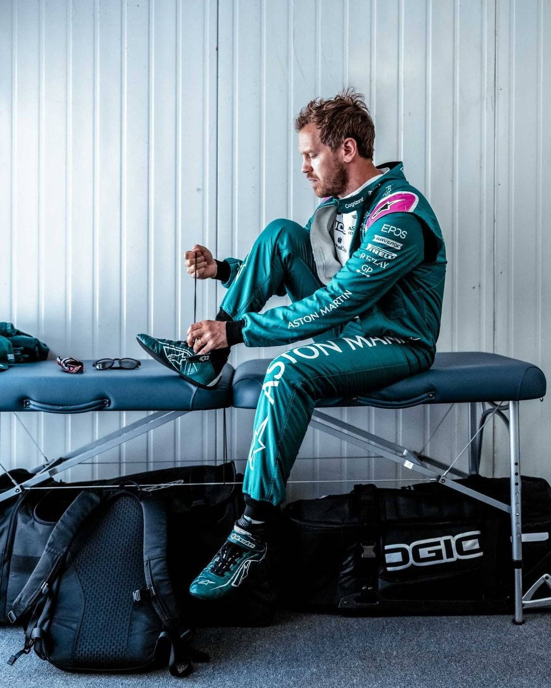 Sebastian Vettel, teal Aston Martin suit, bench, HD Phone Wallpaper