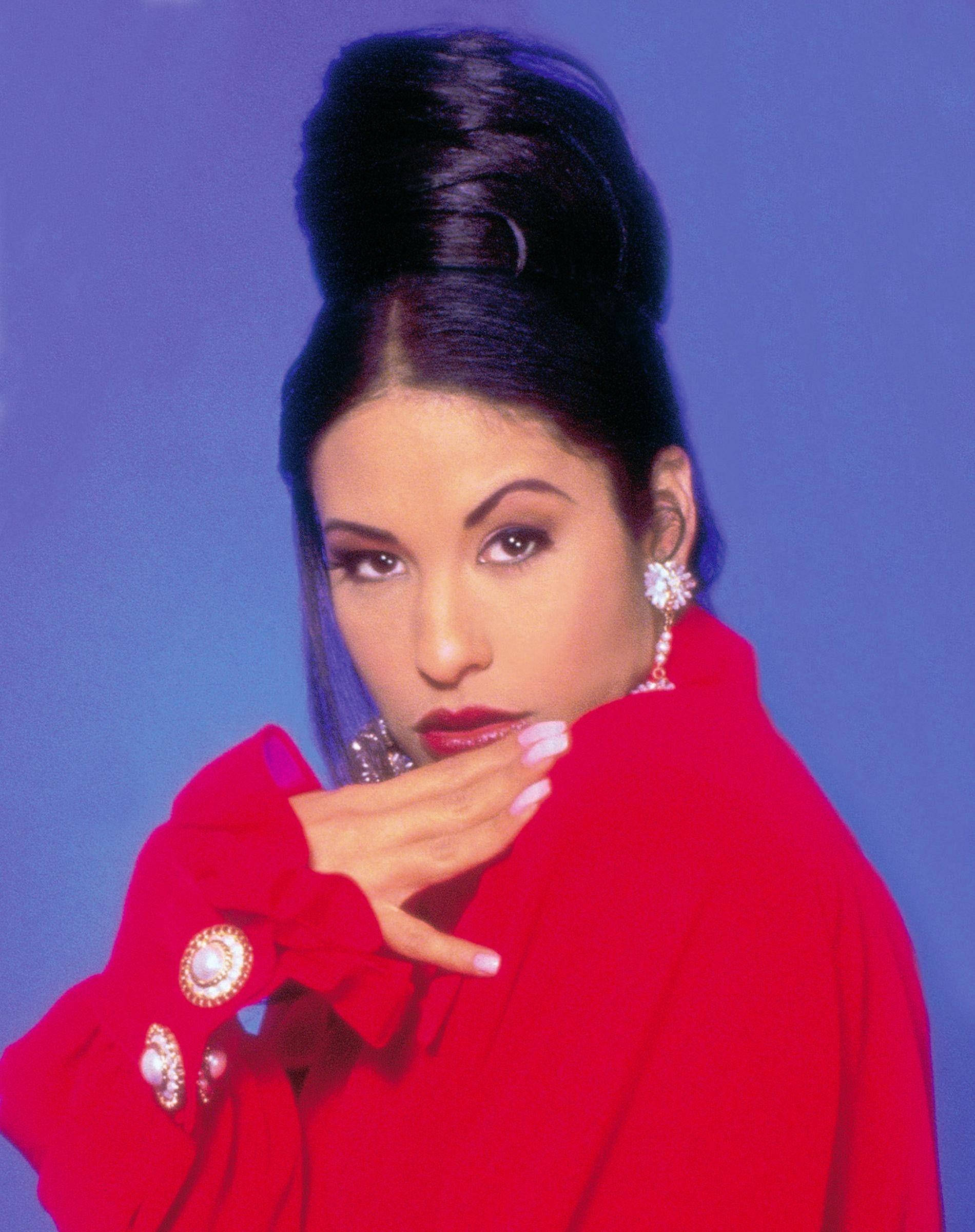 Selena Quintanilla, bold red coat, solid blue background, Full HD Phone Wallpaper