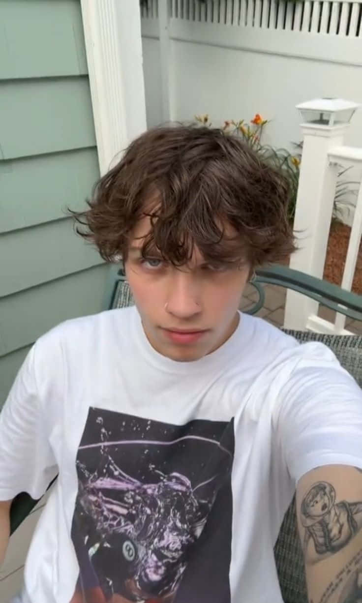 young man, curly brown hair, nose ring, SD Phone Wallpaper