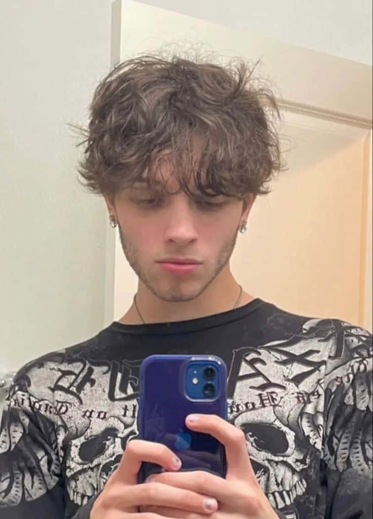 young man, tousled brown hair, skull-print shirt, SD Phone Wallpaper