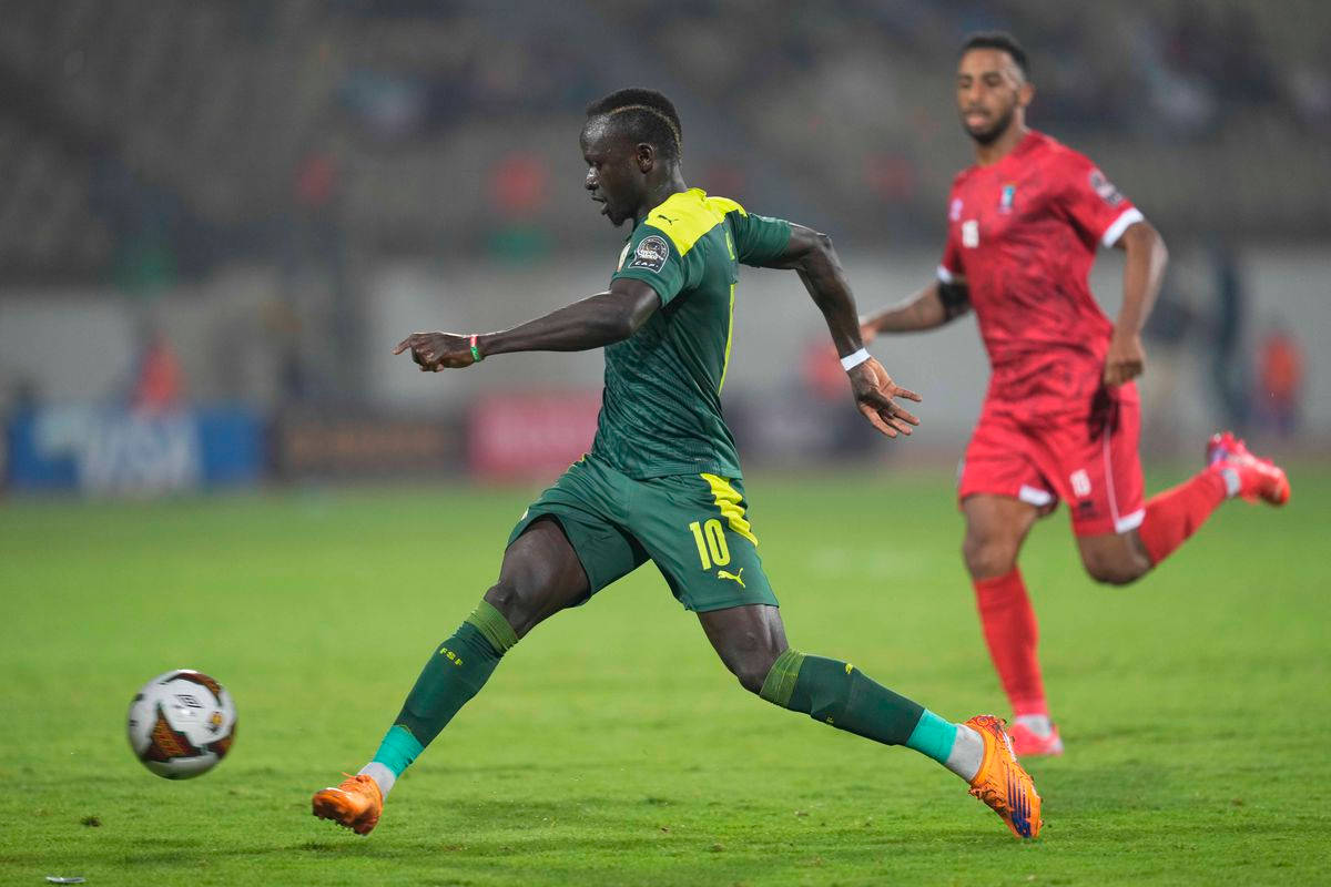 Senegal National Football Team, green and yellow jersey, red-jerseyed opponent, SD Desktop Wallpaper