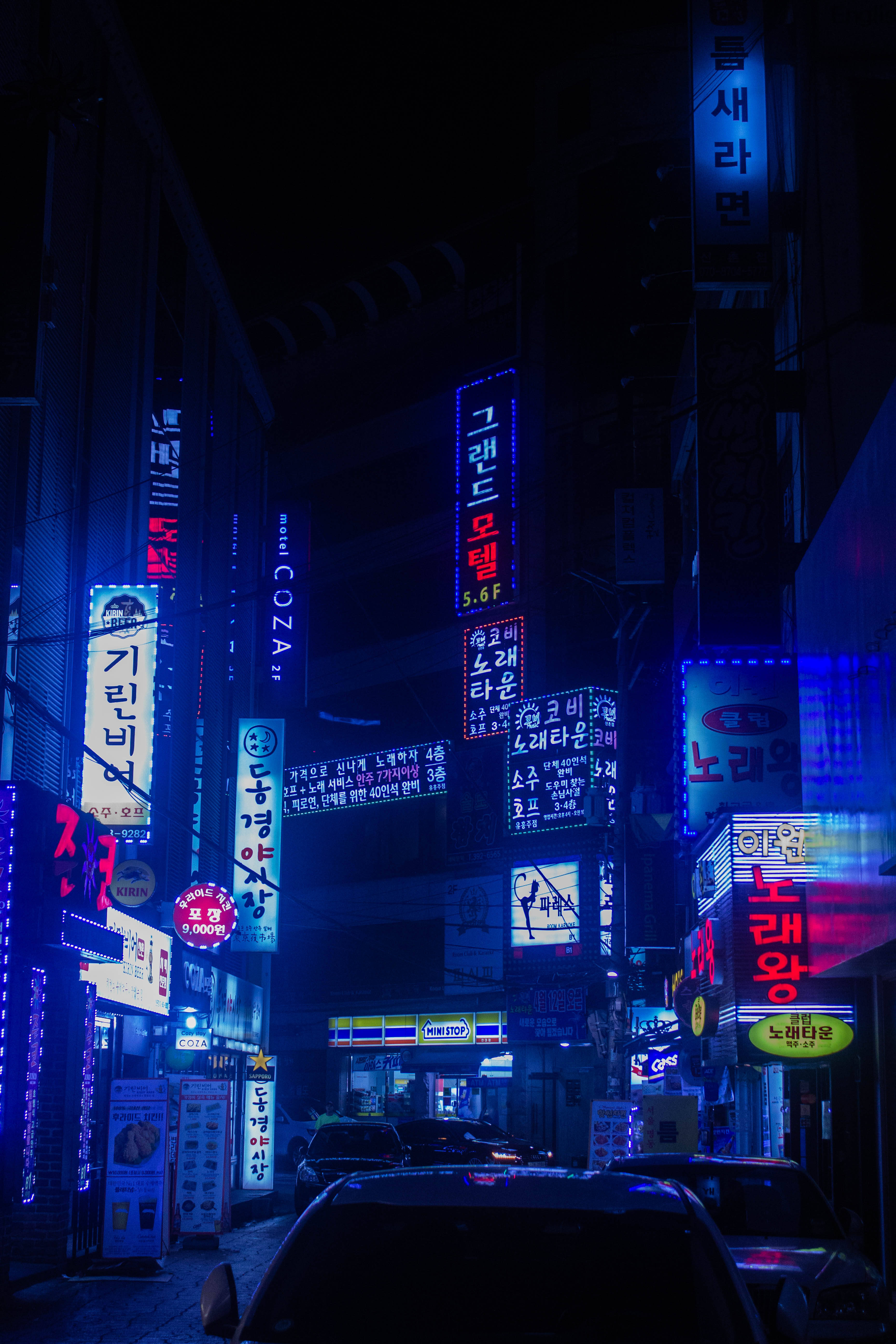 Seoul, midnight blue, neon-lit alley, 5K Phone Wallpaper