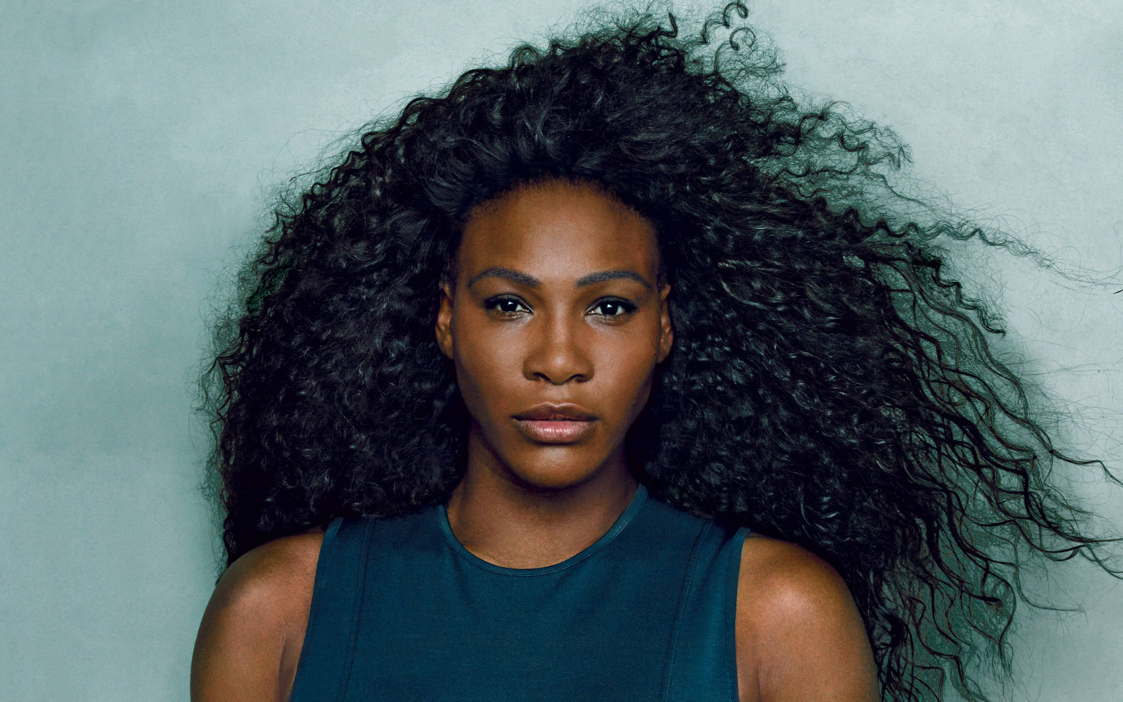Serena Williams, voluminous dark curls, muted teal backdrop, 4K Desktop Wallpaper
