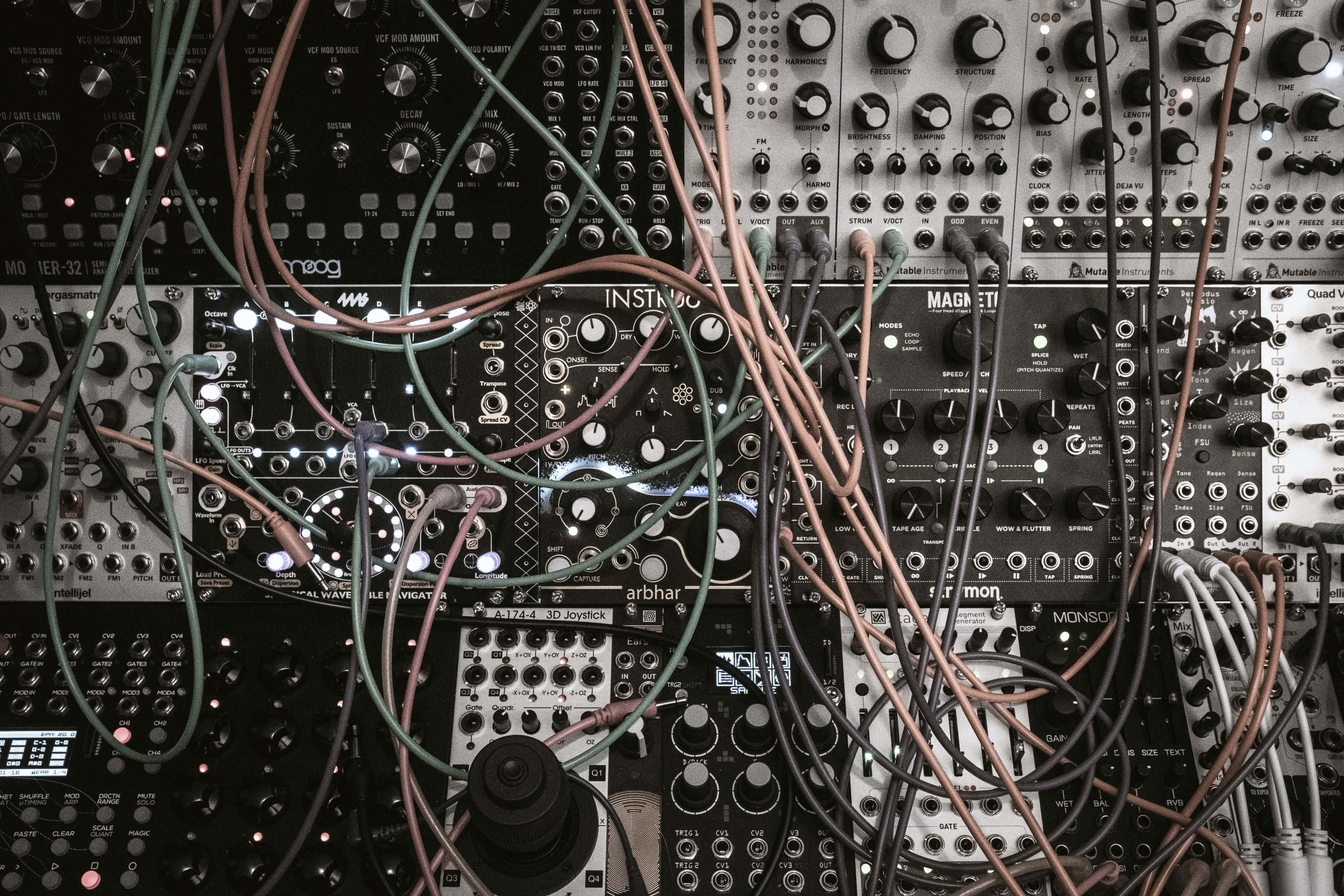modular synthesizer, black and silver modular synthesizer modules, colorful cables, 2K Desktop Wallpaper