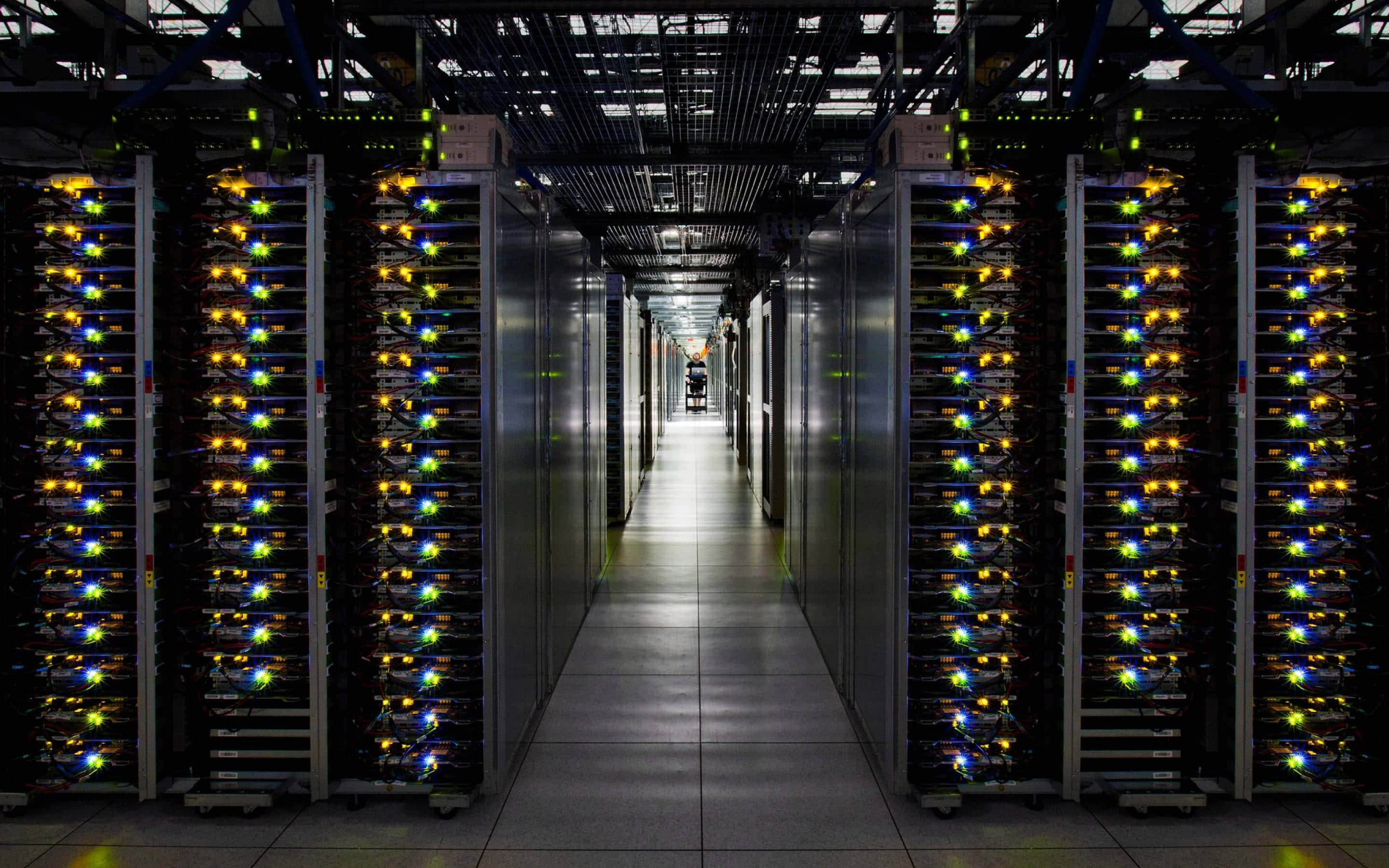 data center, server racks, glowing indicator lights, 2K Desktop Wallpaper