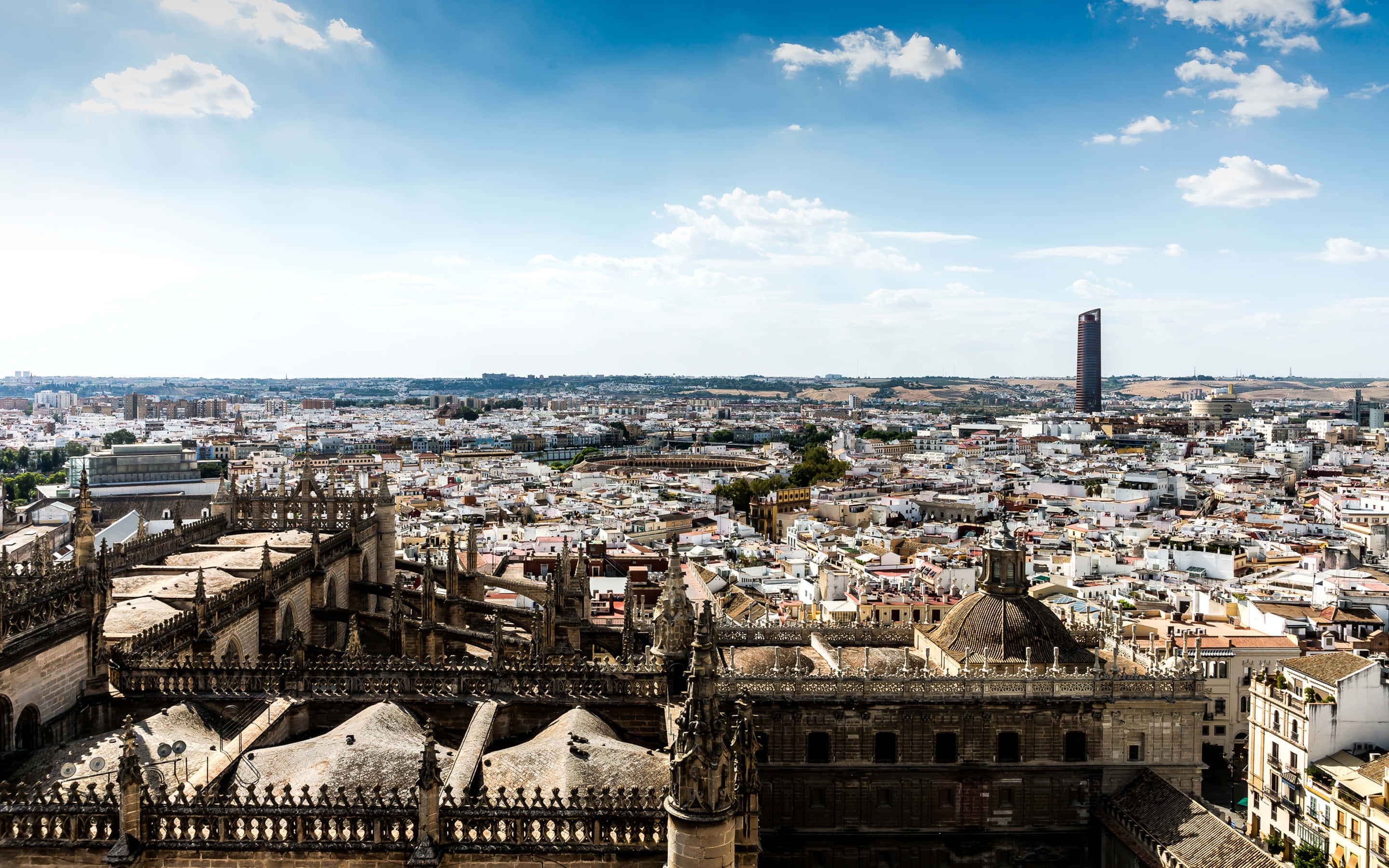 Seville Cathedral, historic cathedral roof, dense cityscape, 2K Desktop Wallpaper