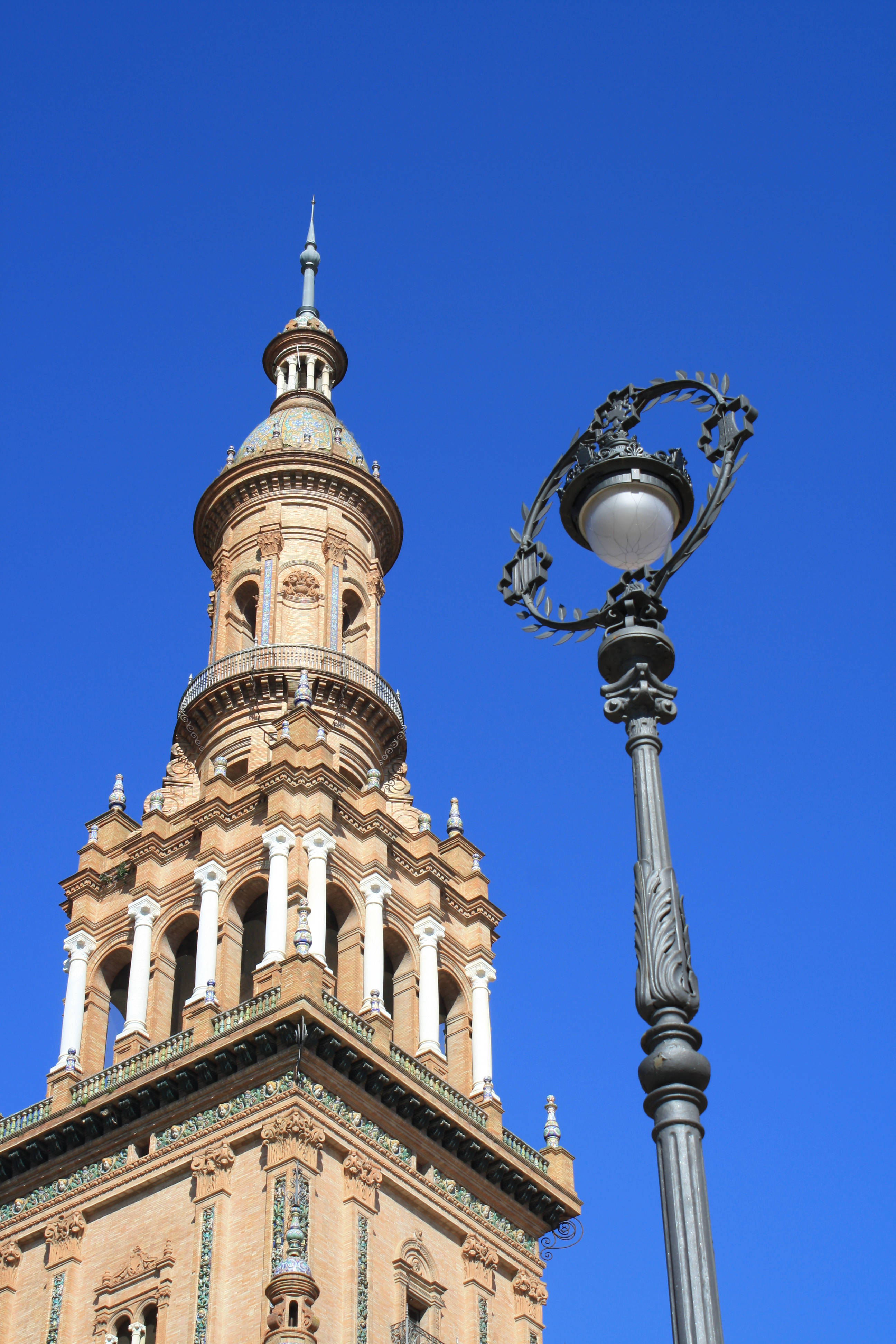 Seville, city street lamp, white columns, 4K Phone Wallpaper