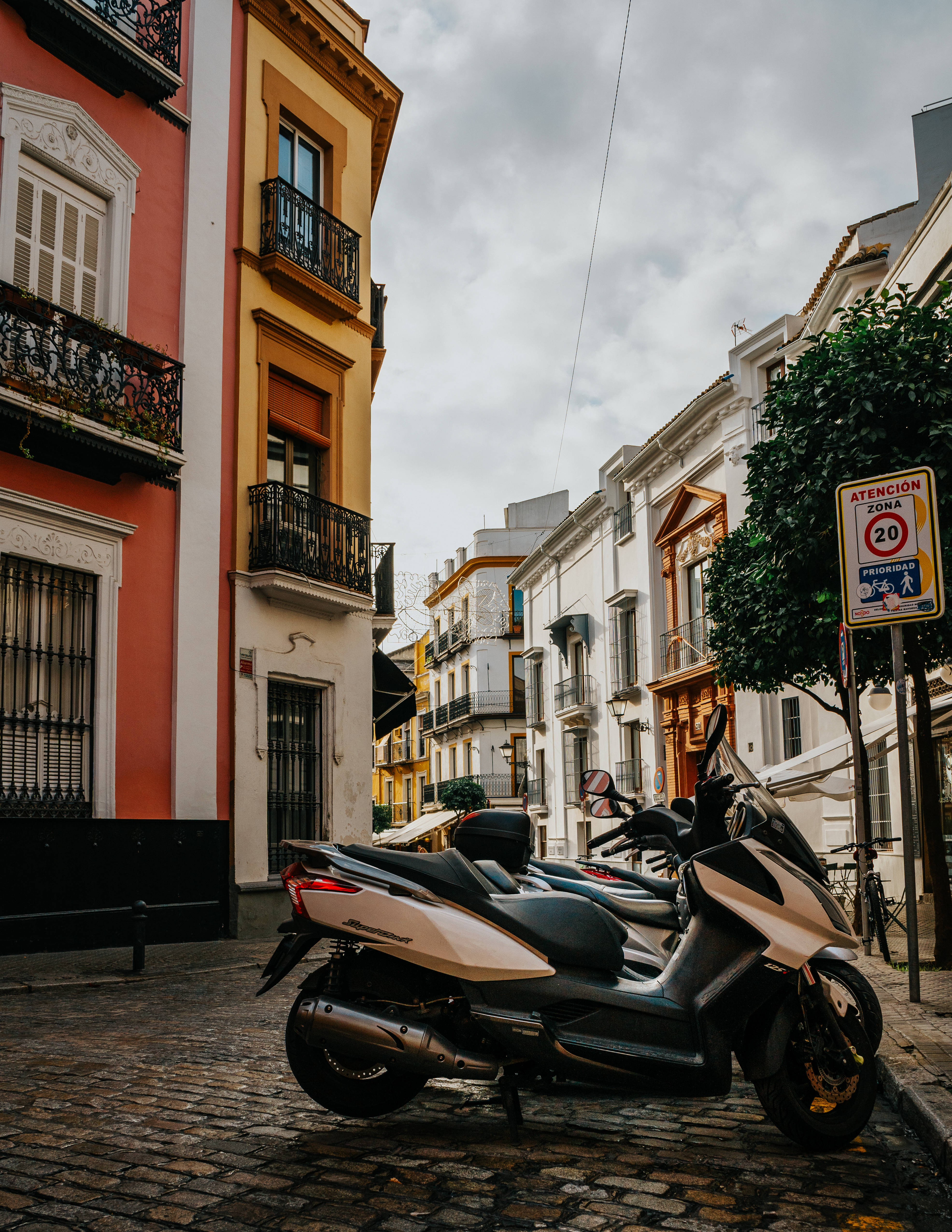 Seville, scooter, cobblestone street, 4K Phone Wallpaper
