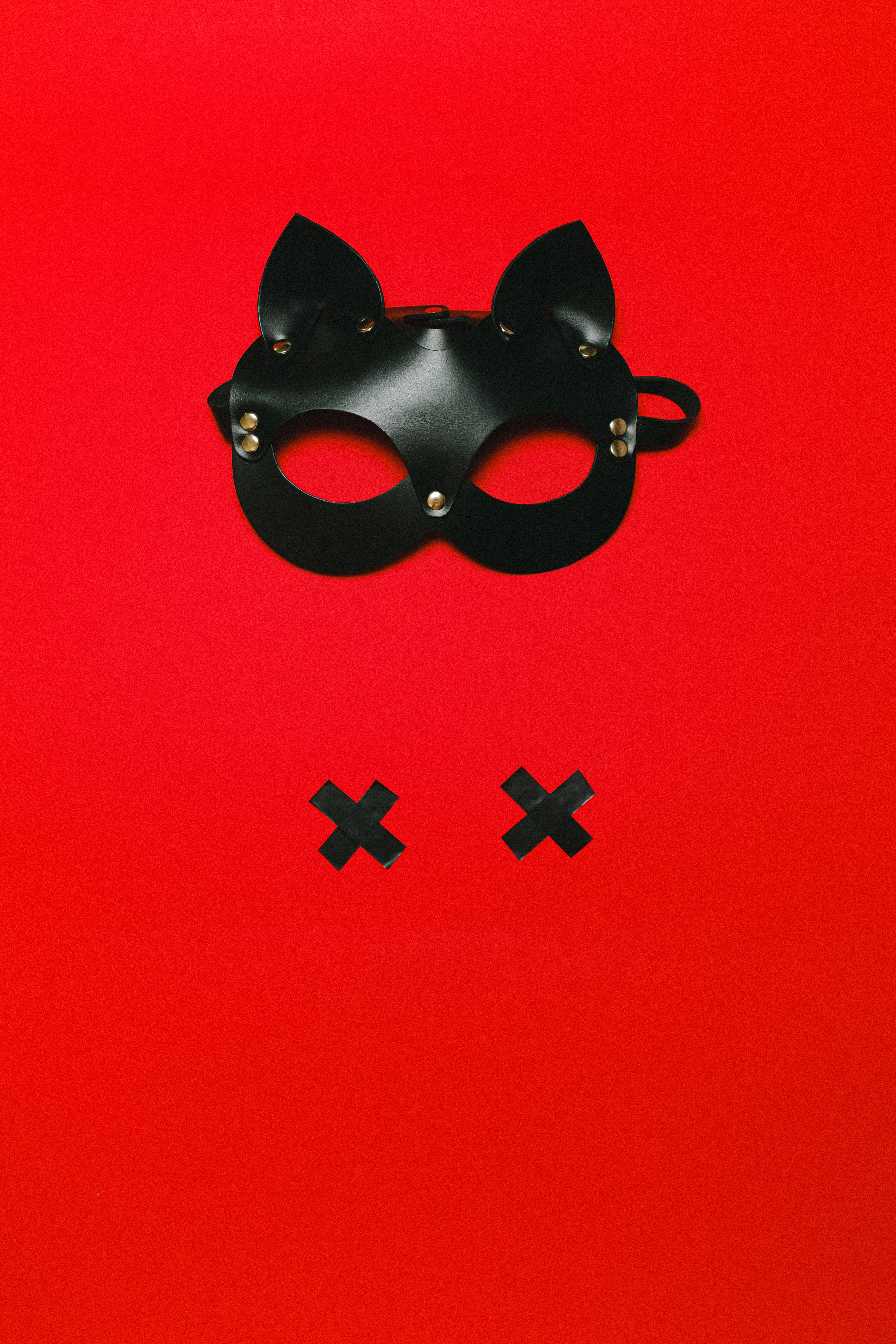 black cat-ear mask, gold rivets, black X marks, 5K Phone Wallpaper
