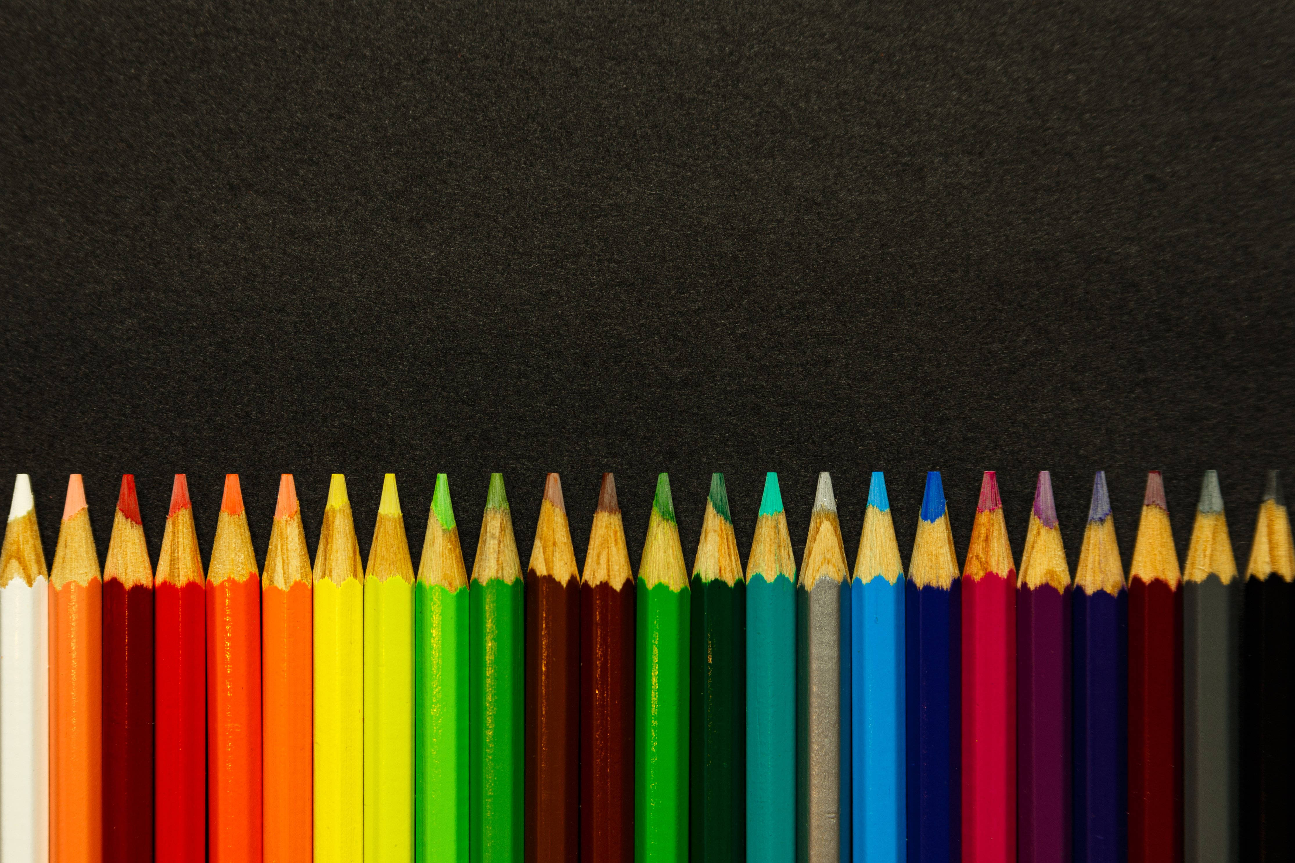 colored sharp pencils, black surface, rainbow order, 4K Desktop Wallpaper