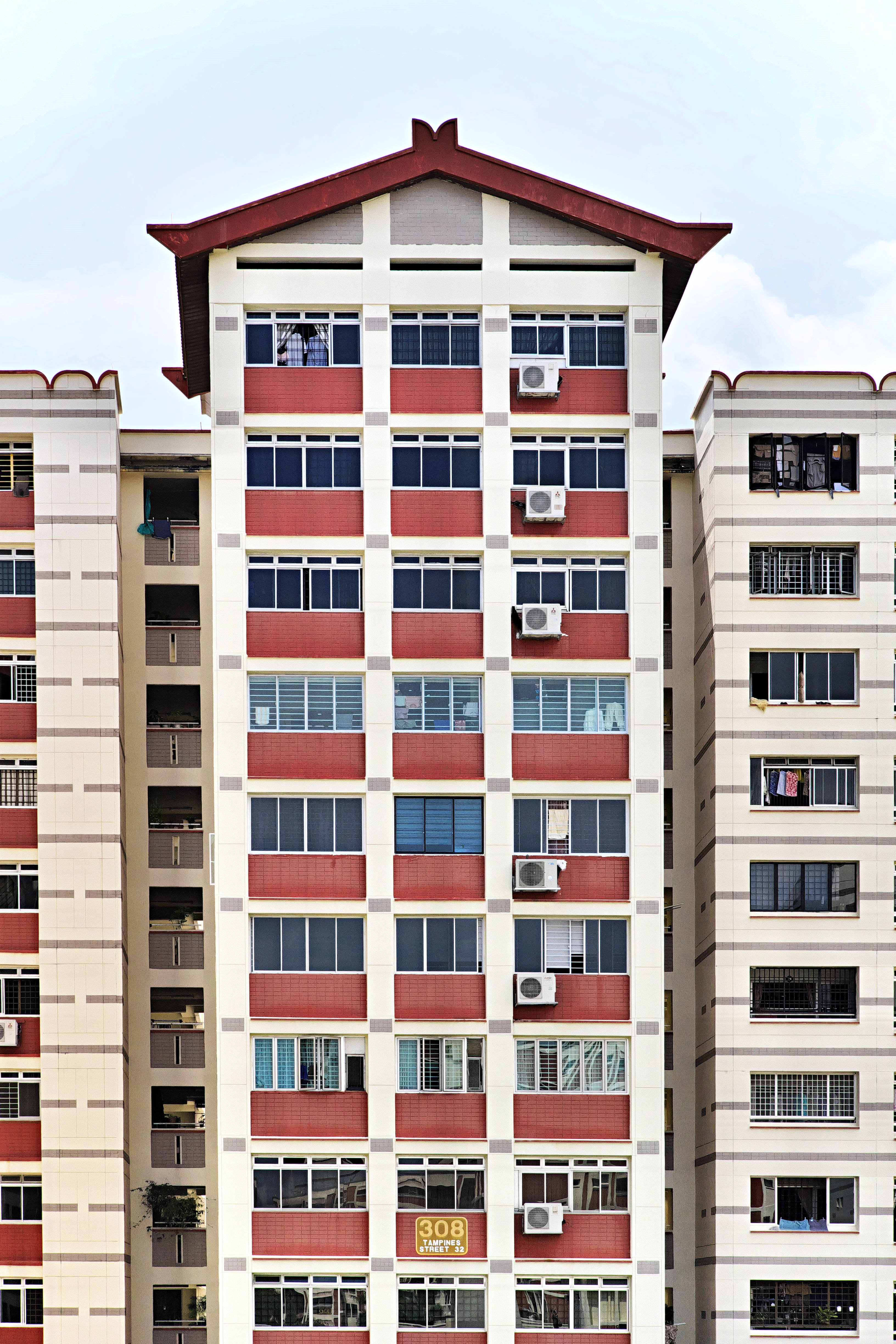 white building, sharp roof, red and white facade, 4K Phone Wallpaper