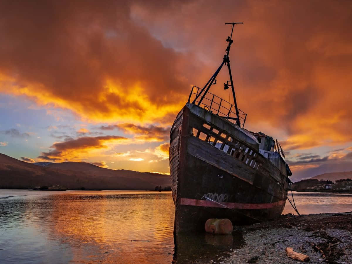 sunken ship, fiery orange clouds, distant mountains, SD Desktop Wallpaper