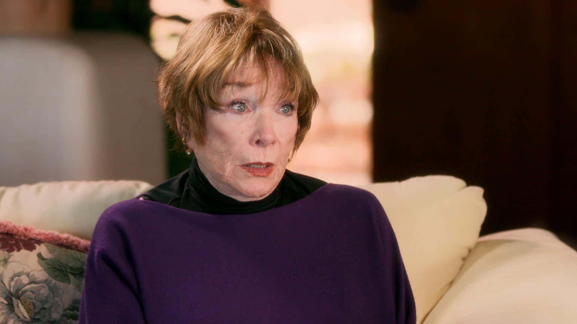 Shirley MacLaine, short blonde hair, purple sweater, Full HD Desktop Wallpaper