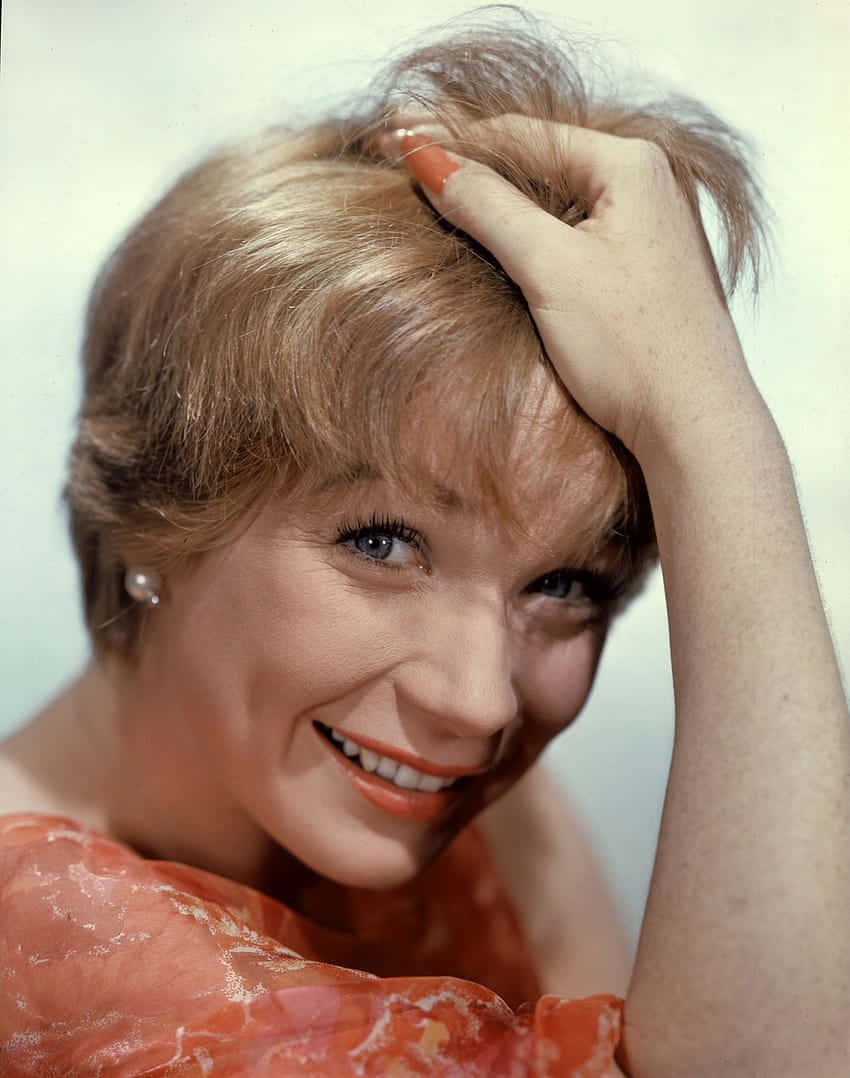 Shirley MacLaine, short blonde hair, orange nail polish, SD Phone Wallpaper