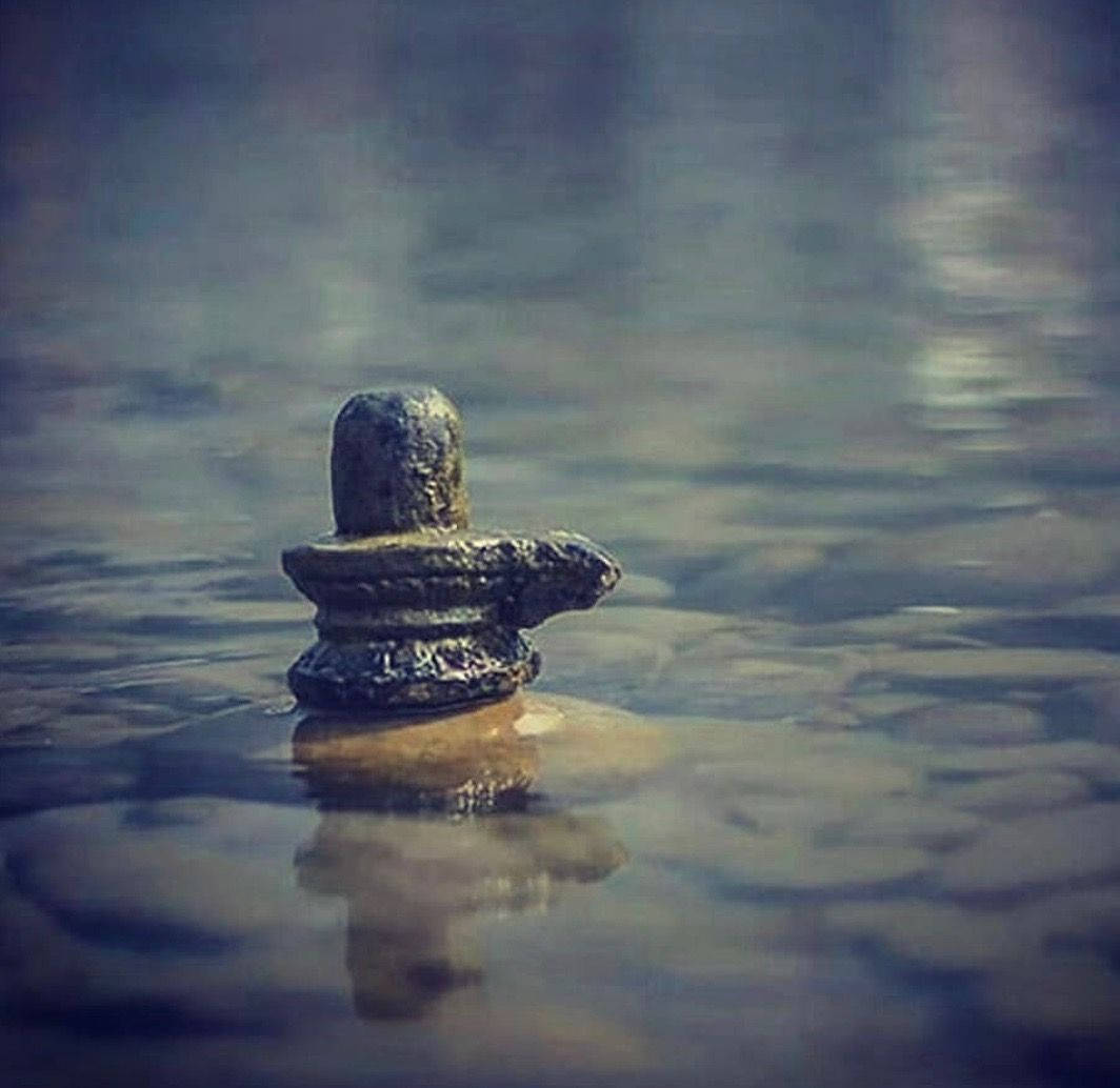 Shiva Lingam, weathered stone, calm water, SD Desktop Wallpaper