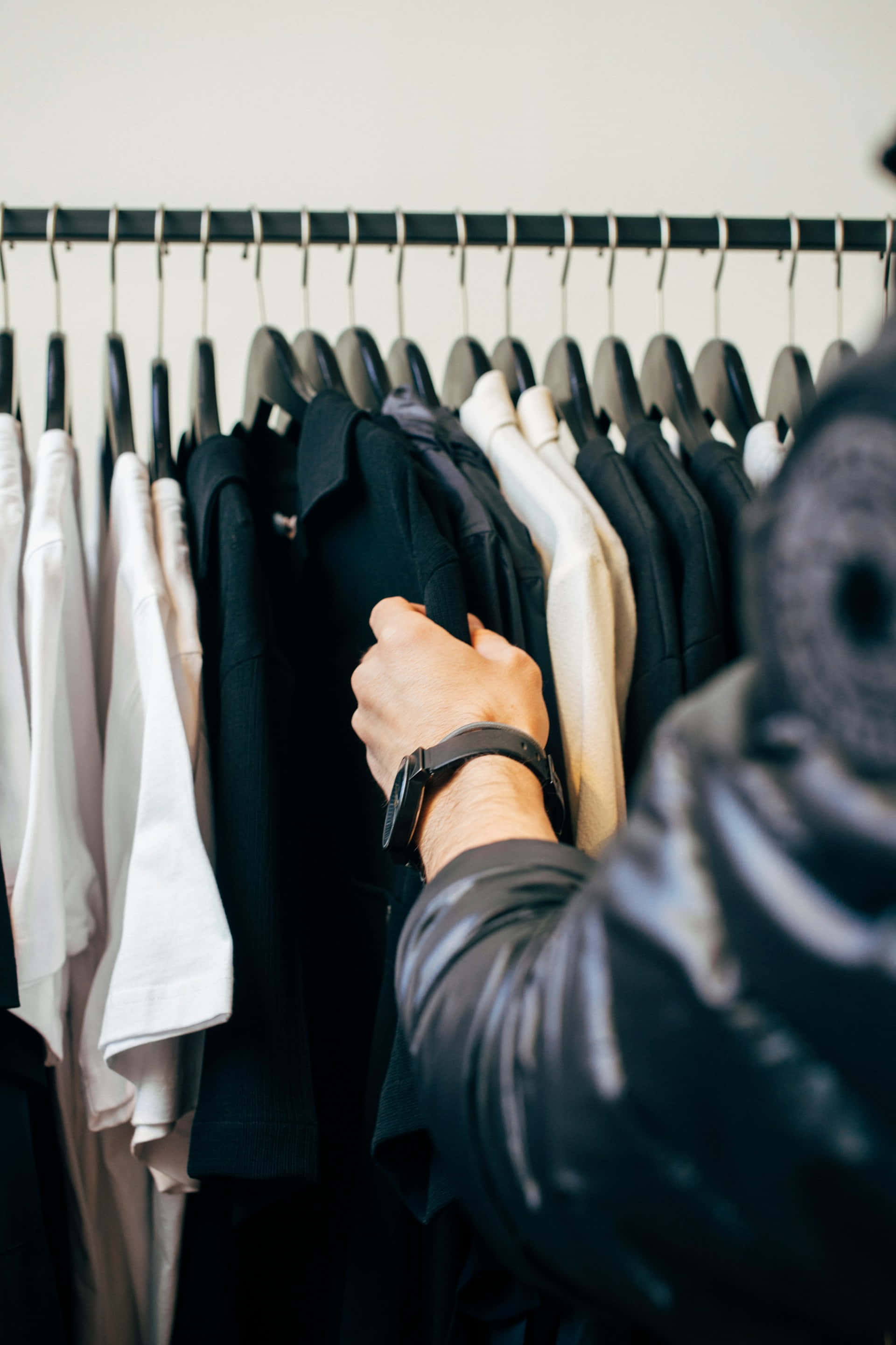 black shirt, minimalist clothing rack, black white and beige garments, 2K Phone Wallpaper
