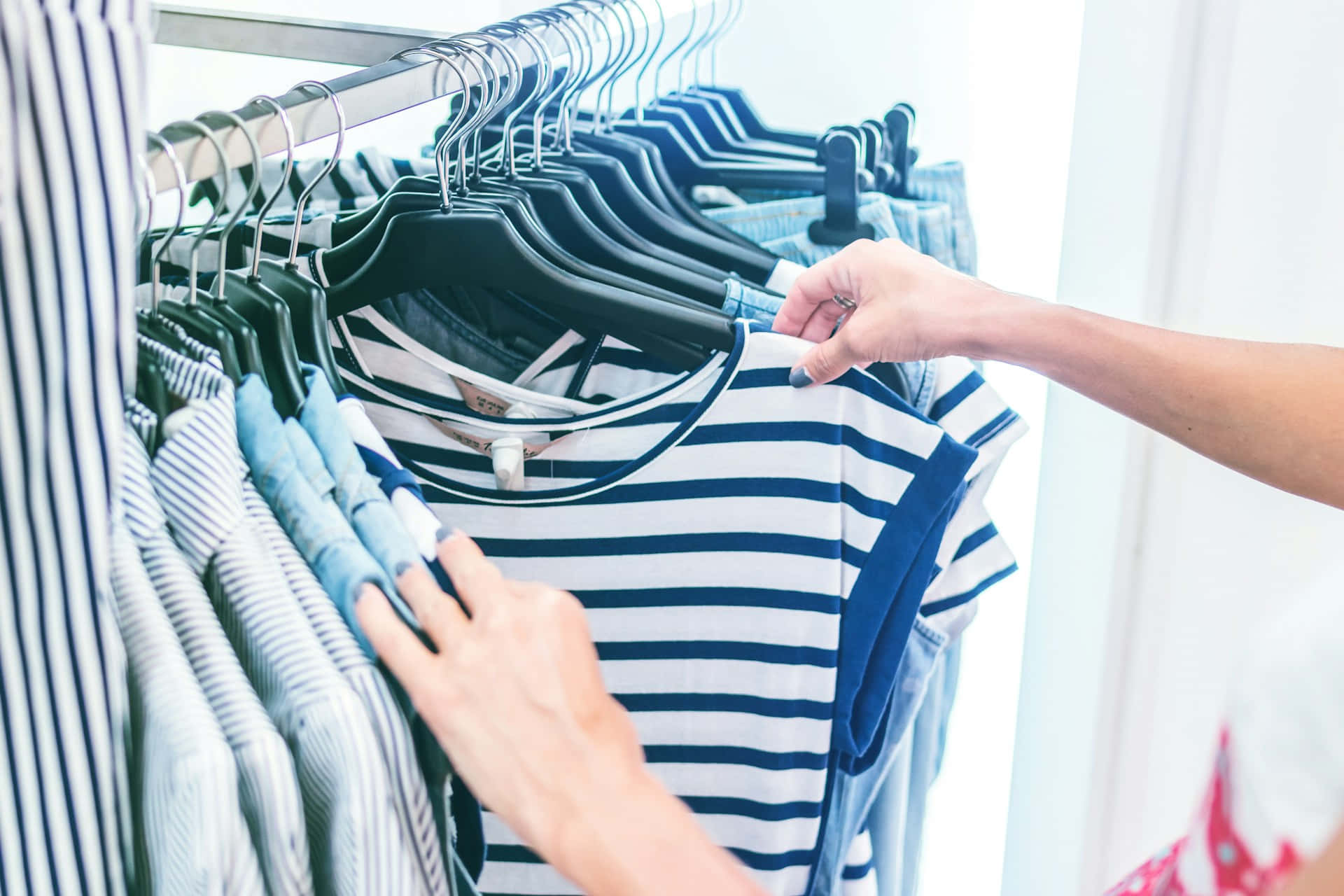 navy and white striped tshirt, rack of similar garments, bright retail setting, Full HD Desktop Wallpaper