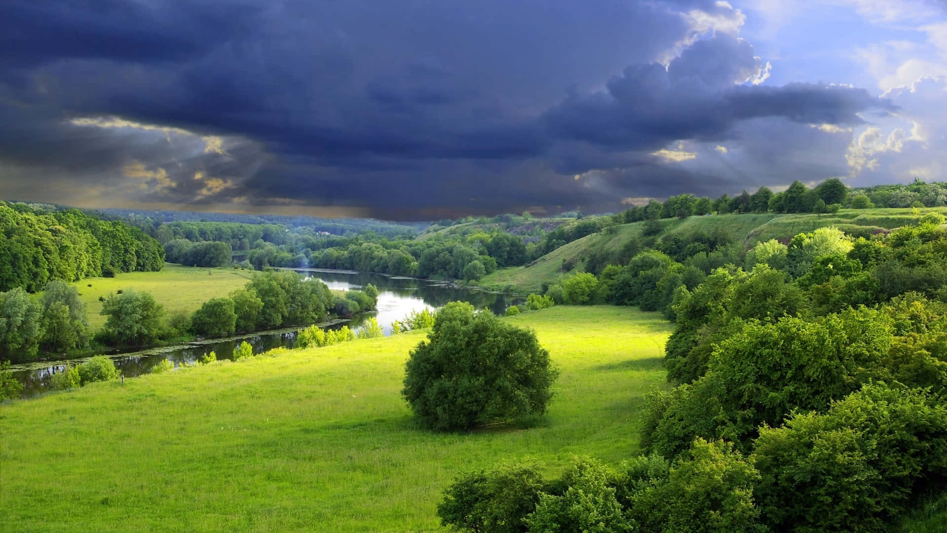 vibrant green meadows, winding river, dramatic sky, Full HD Desktop Wallpaper