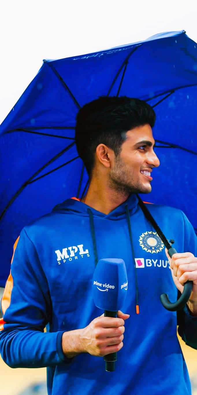 Shubman Gill, blue sports hoodie, blue umbrella, HD Phone Wallpaper