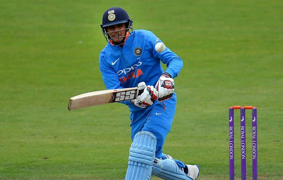 Shubman Gill, blue uniform, bat, SD Desktop Wallpaper