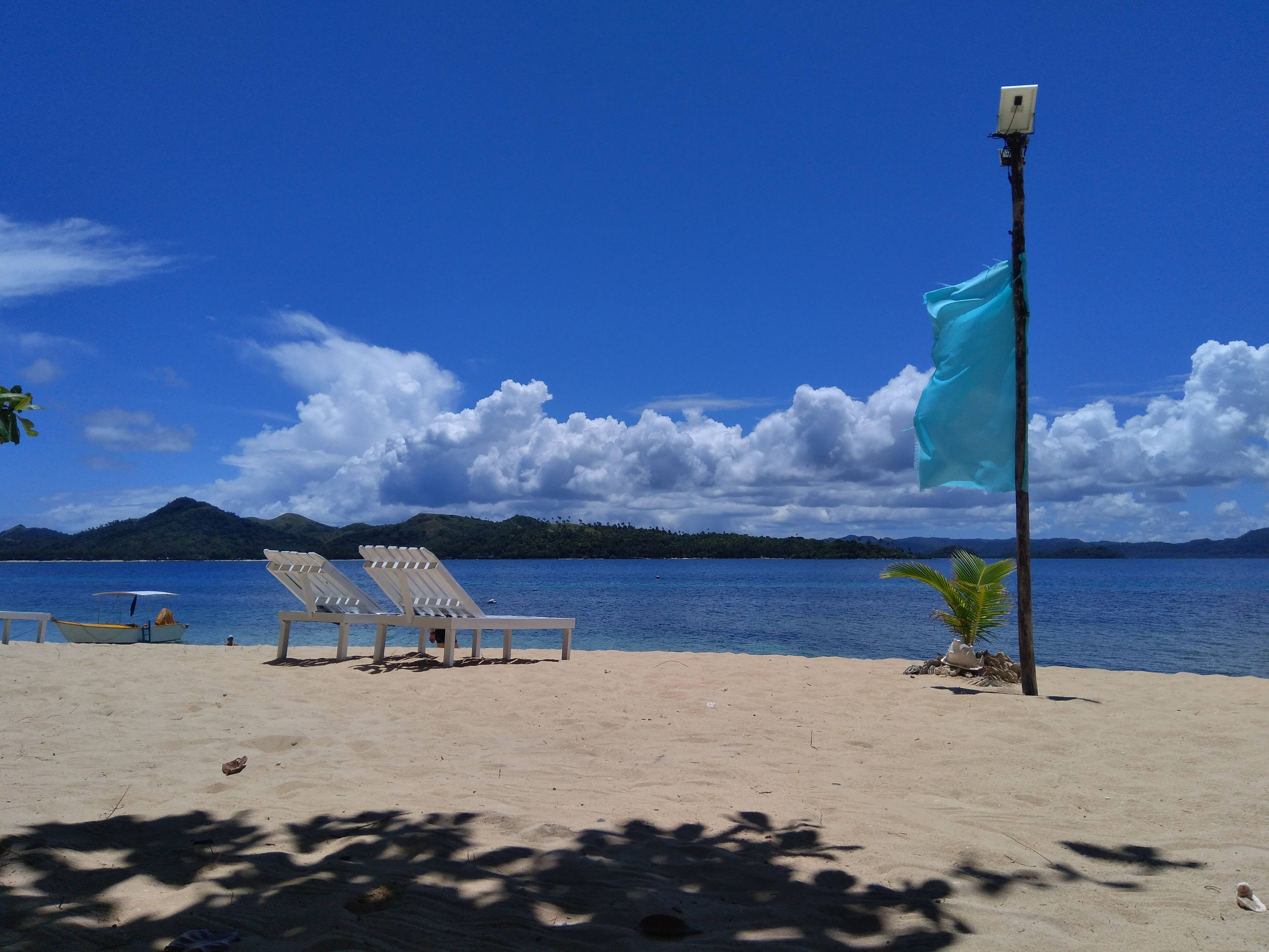 Siargao Island, white lounge chairs, sandy beach, 4K Desktop Wallpaper