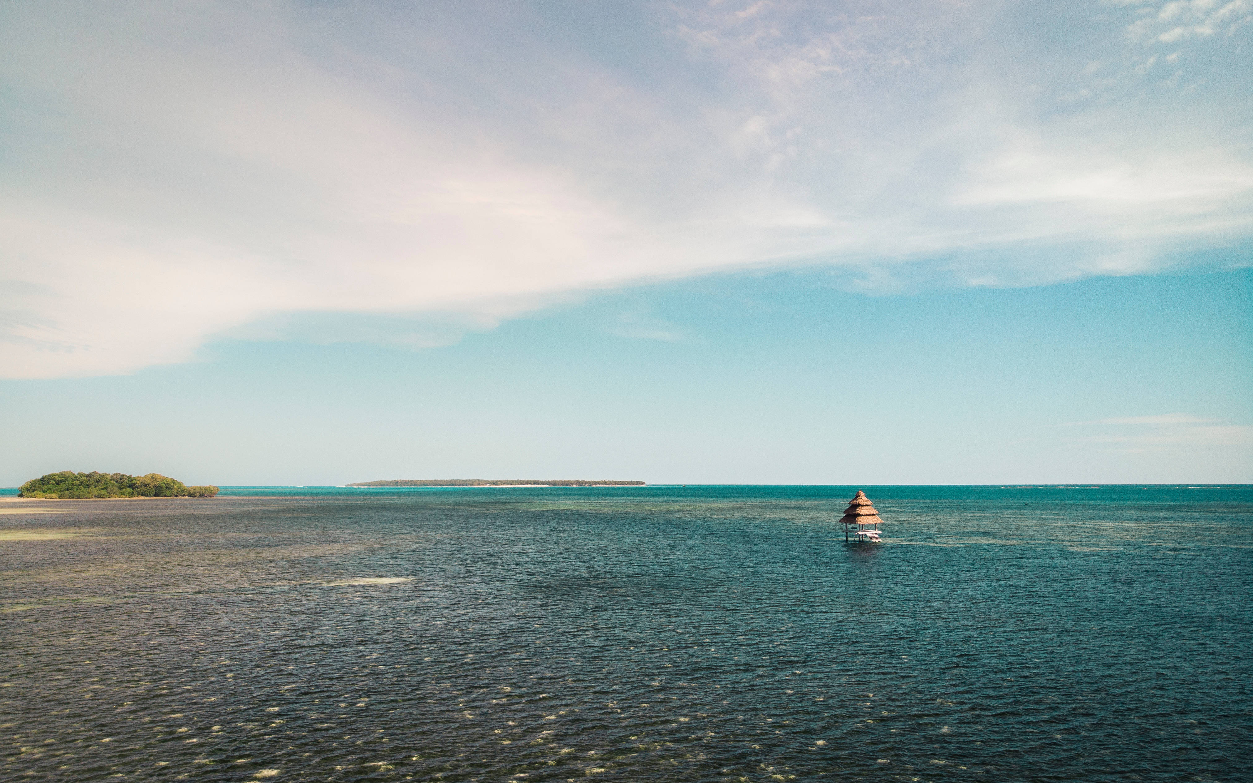 Siargao Island, thatched-roof hut, calm turquoise waters, 4K Desktop Wallpaper