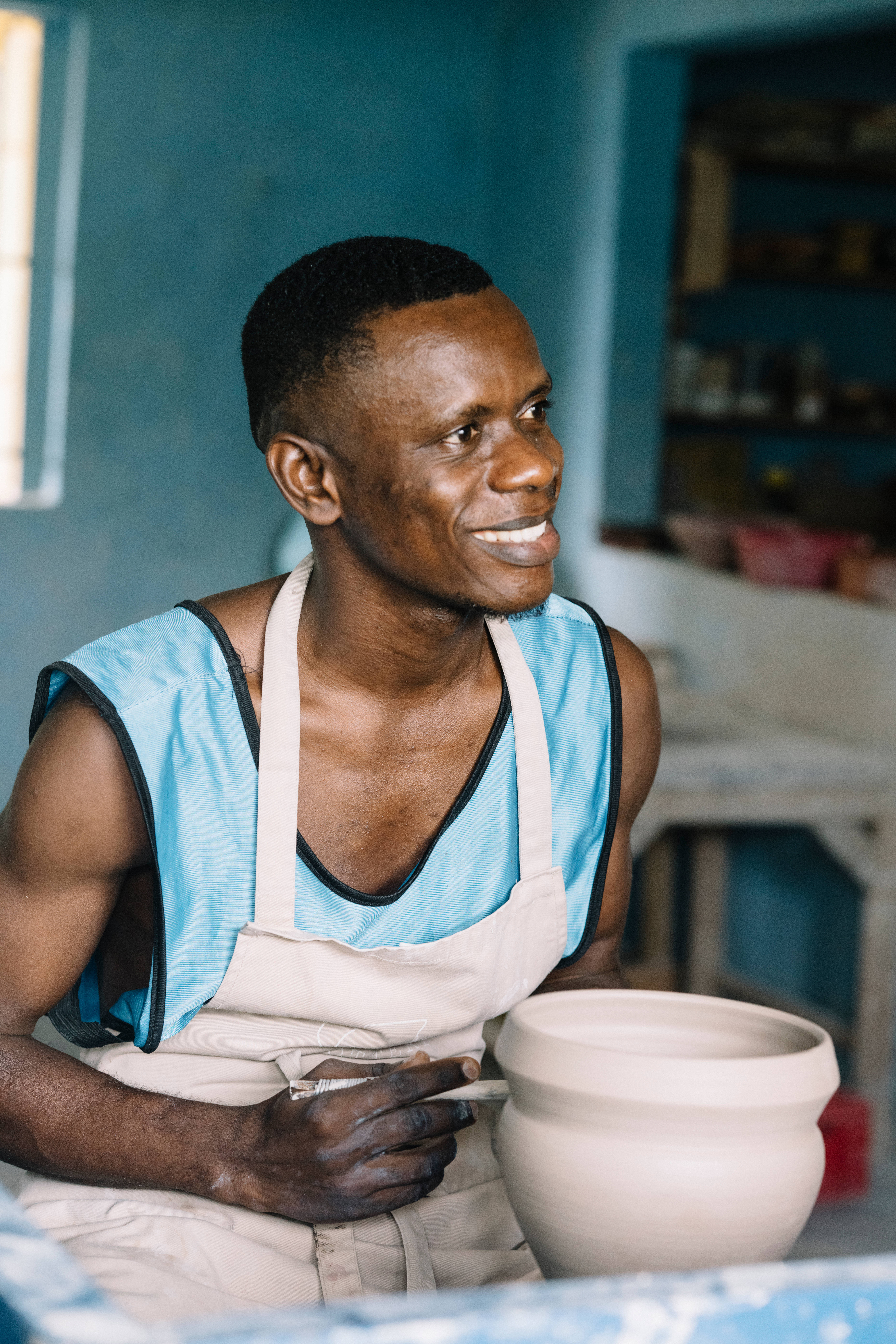 Sierra Leone, potter, blue shirt, 8K Phone Wallpaper