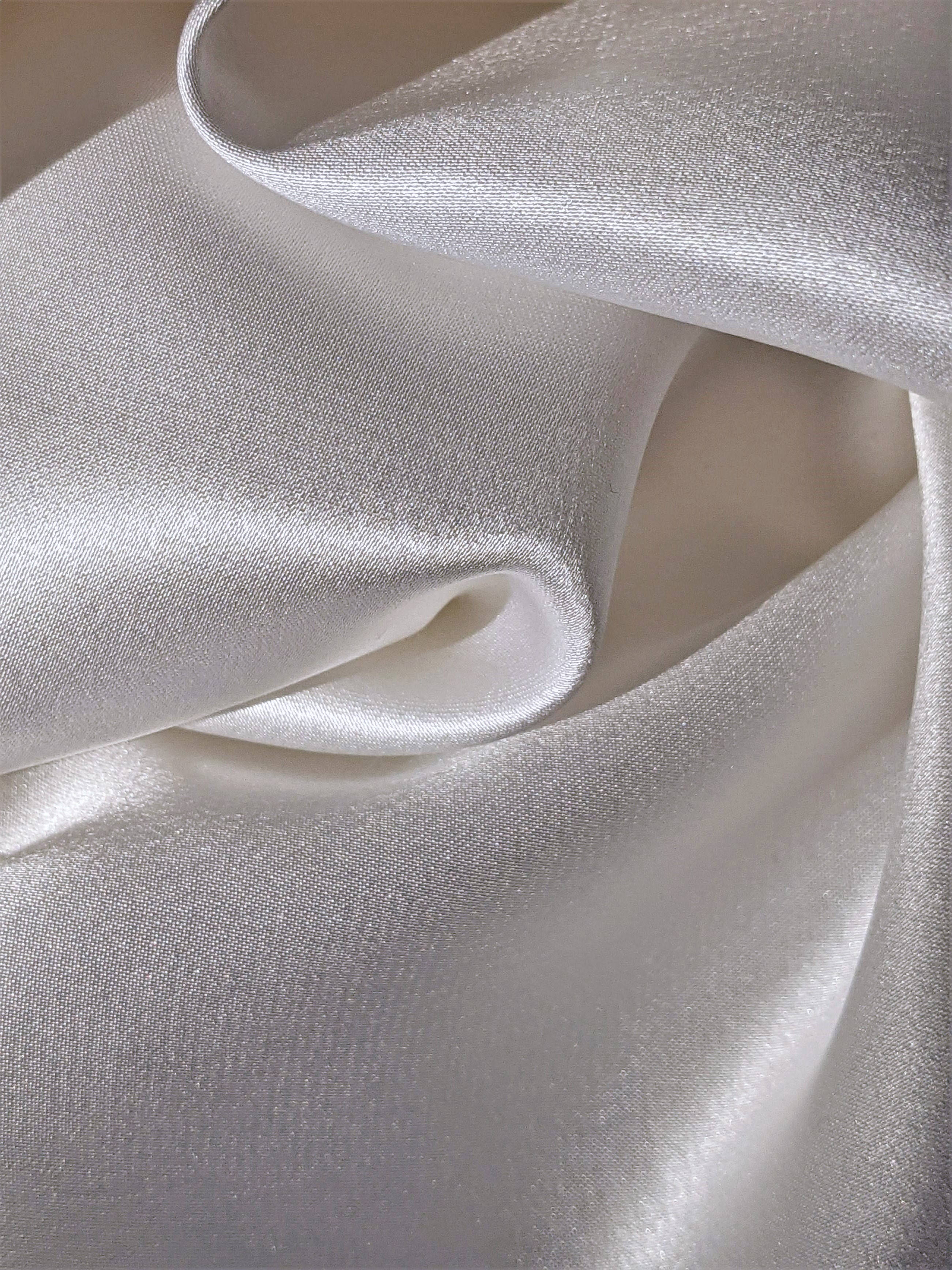 smooth white silk, luxurious white silk fabric, soft folds, 2K Phone Wallpaper