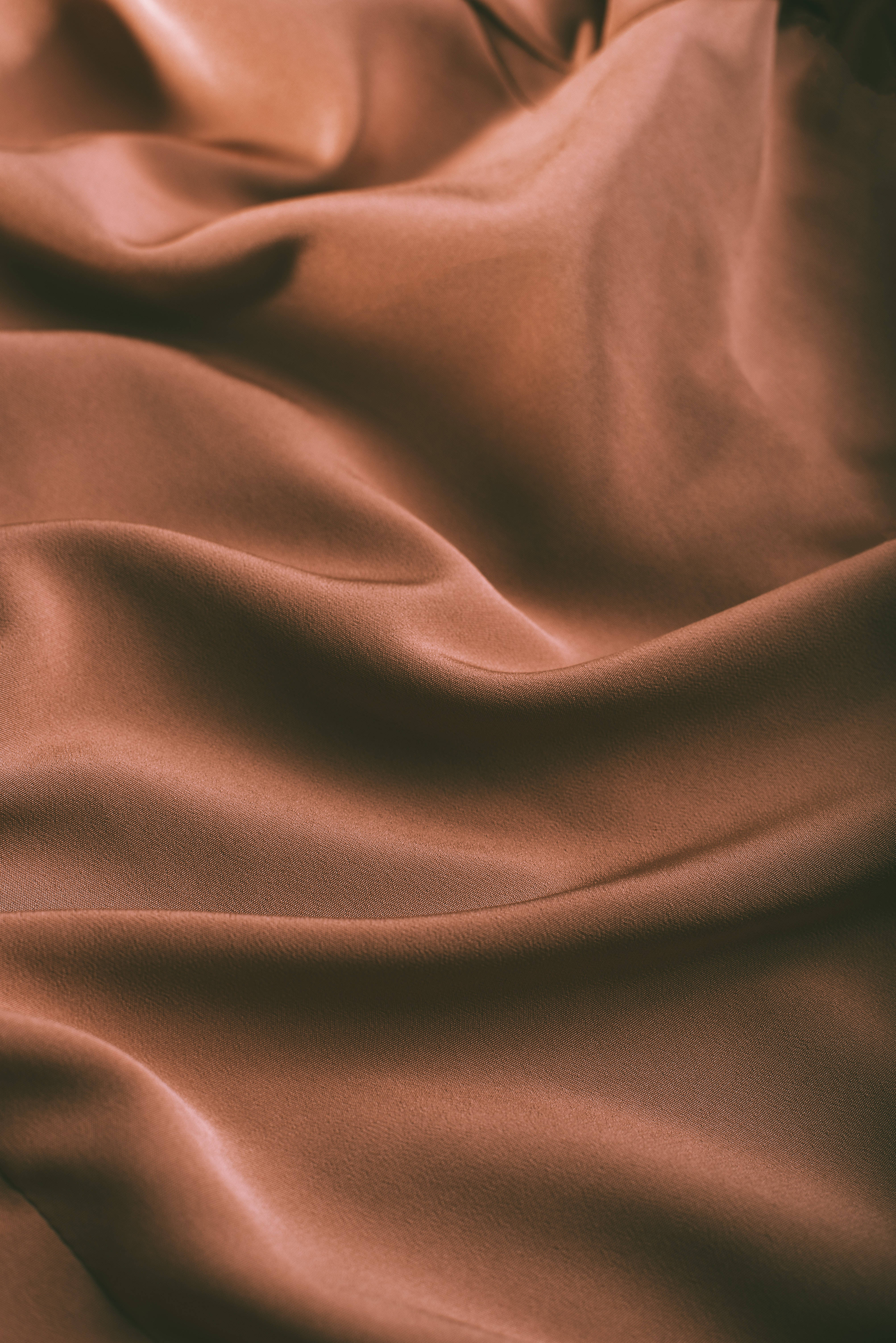 silky brown textured cloth, rich brown silk fabric, soft folds, 5K Phone Wallpaper