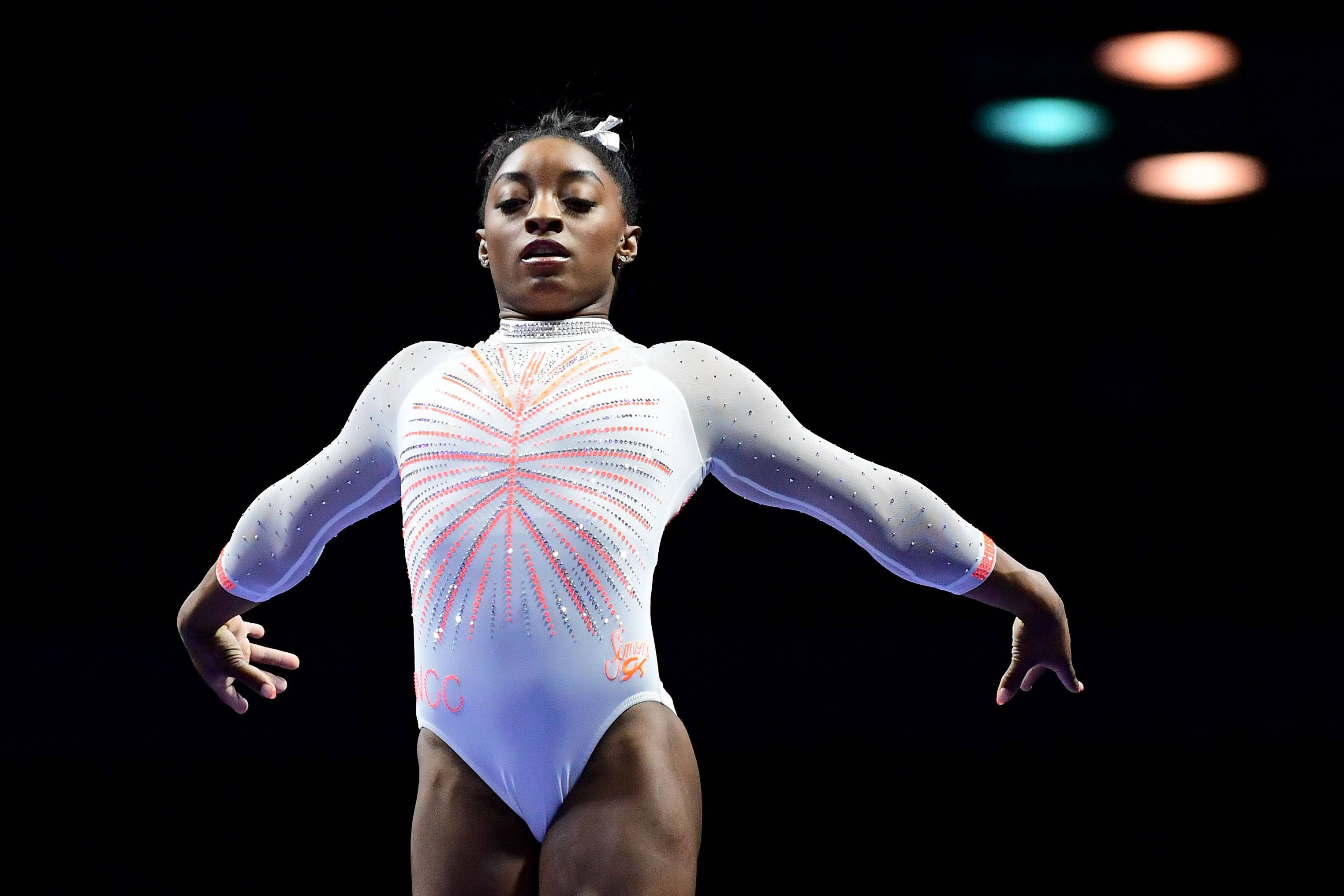 Simon Biles, sparkling white leotard, pink fireworks design, 2K Desktop Wallpaper