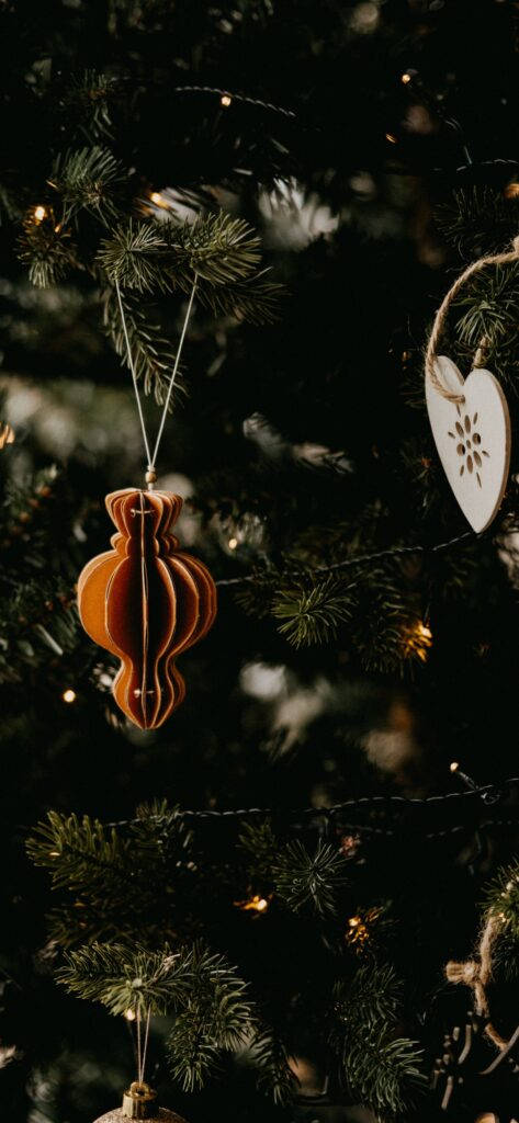 simple christmas tree hanging decorations, warm wooden ornaments, dark green pine tree, SD Phone Wallpaper