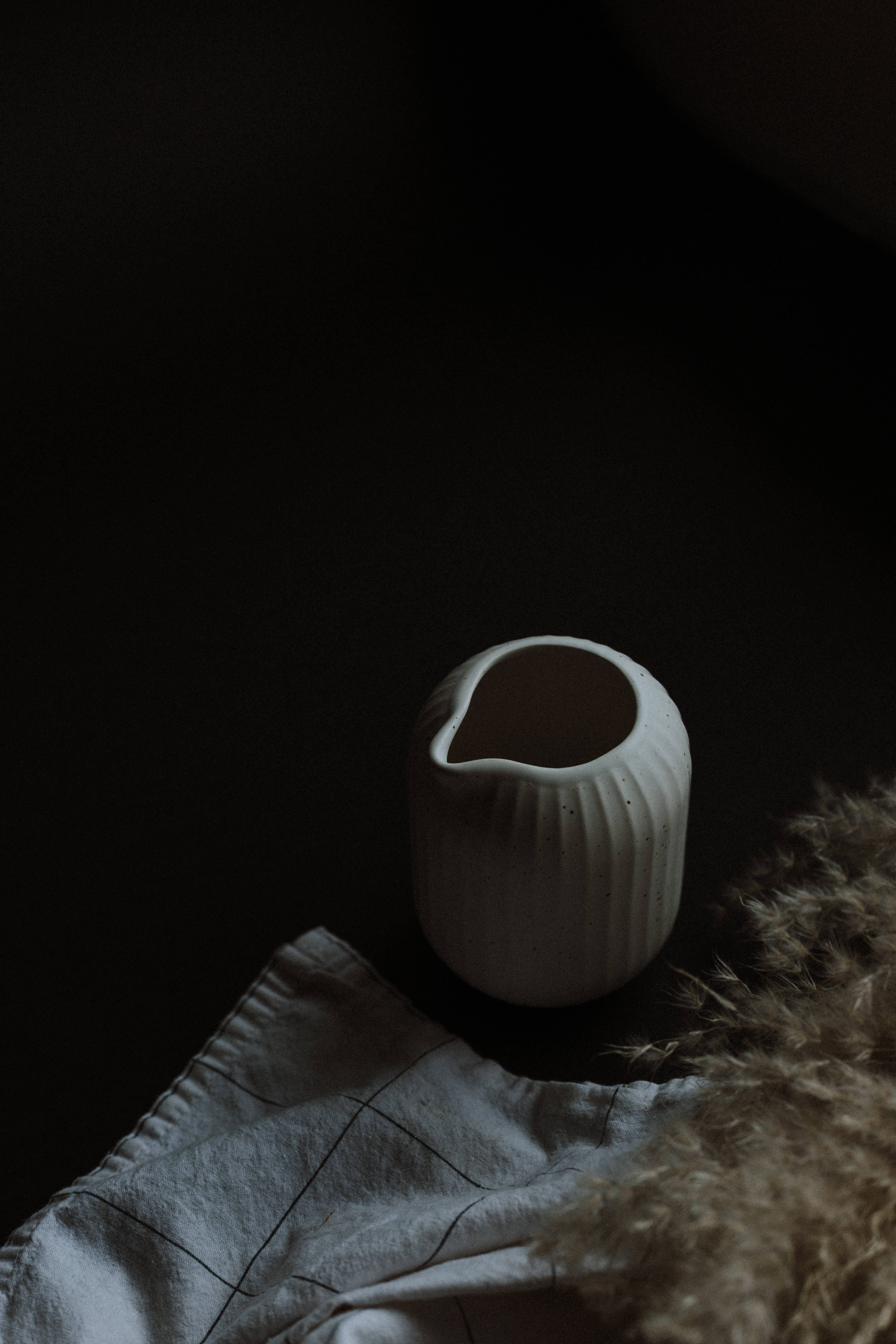 Simple Dark Aesthetic, white ceramic pitcher, vertical ridges, 5K Phone Wallpaper