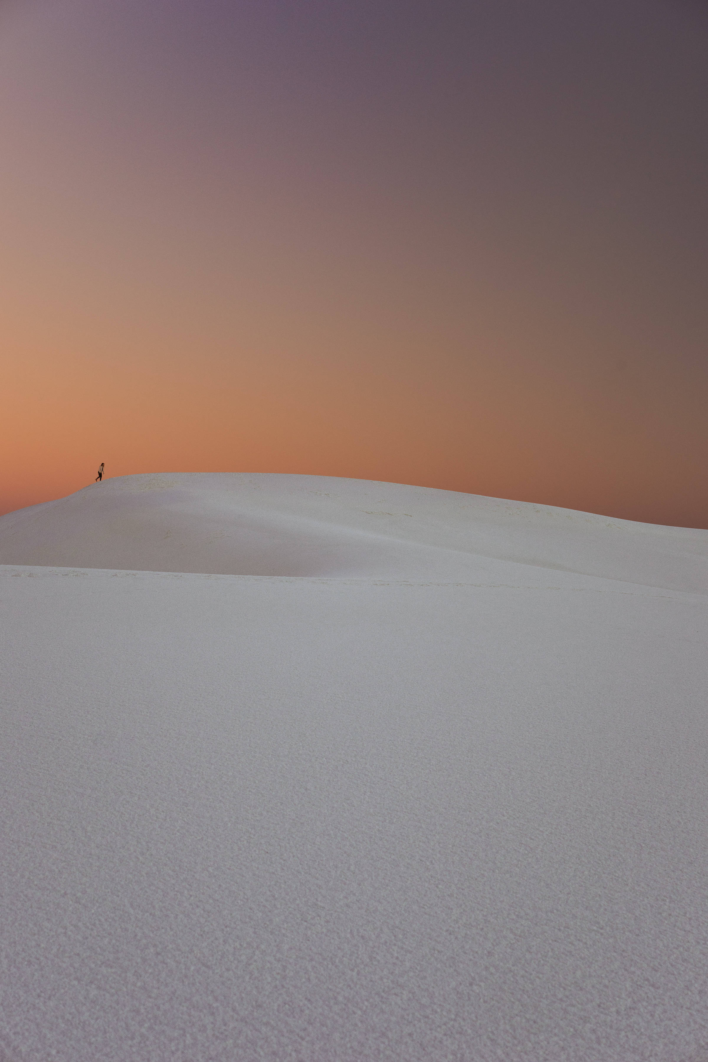 Serenity at Sunrise, vast white dune, gradient sky of purple and orange, 2K Phone Wallpaper