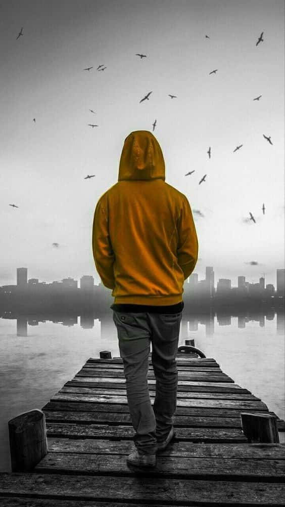 Single Boy, yellow hoodie, weathered wooden dock, SD Phone Wallpaper
