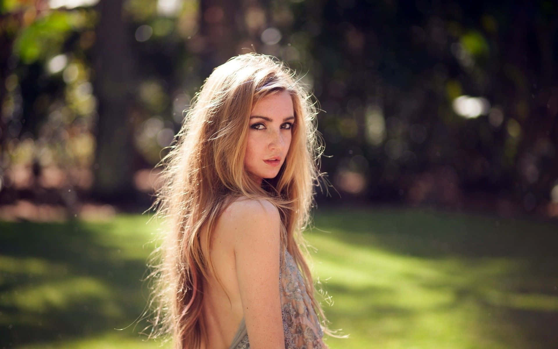 long blonde hair, sunlit garden, blurred green foliage, Full HD Desktop Wallpaper