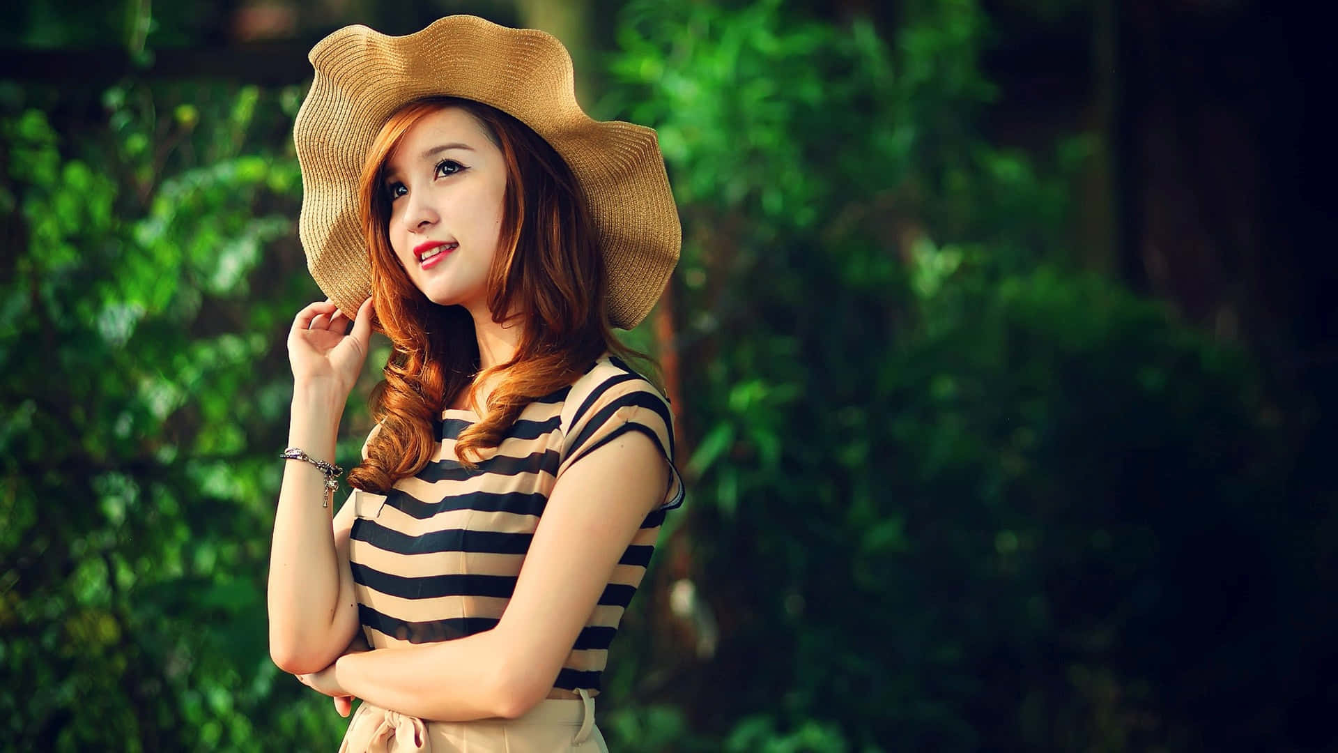 wide-brimmed straw hat, striped top, lush green foliage, Full HD Desktop Wallpaper