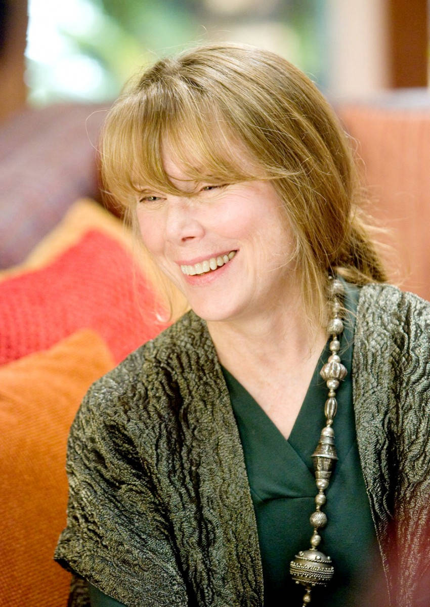 Sissy Spacek, blonde hair, orange cushions, SD Phone Wallpaper