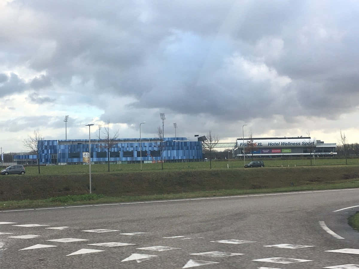 Sittard Stadium, blue patterned sports complex, adjacent hotel wellness center, SD Desktop Wallpaper
