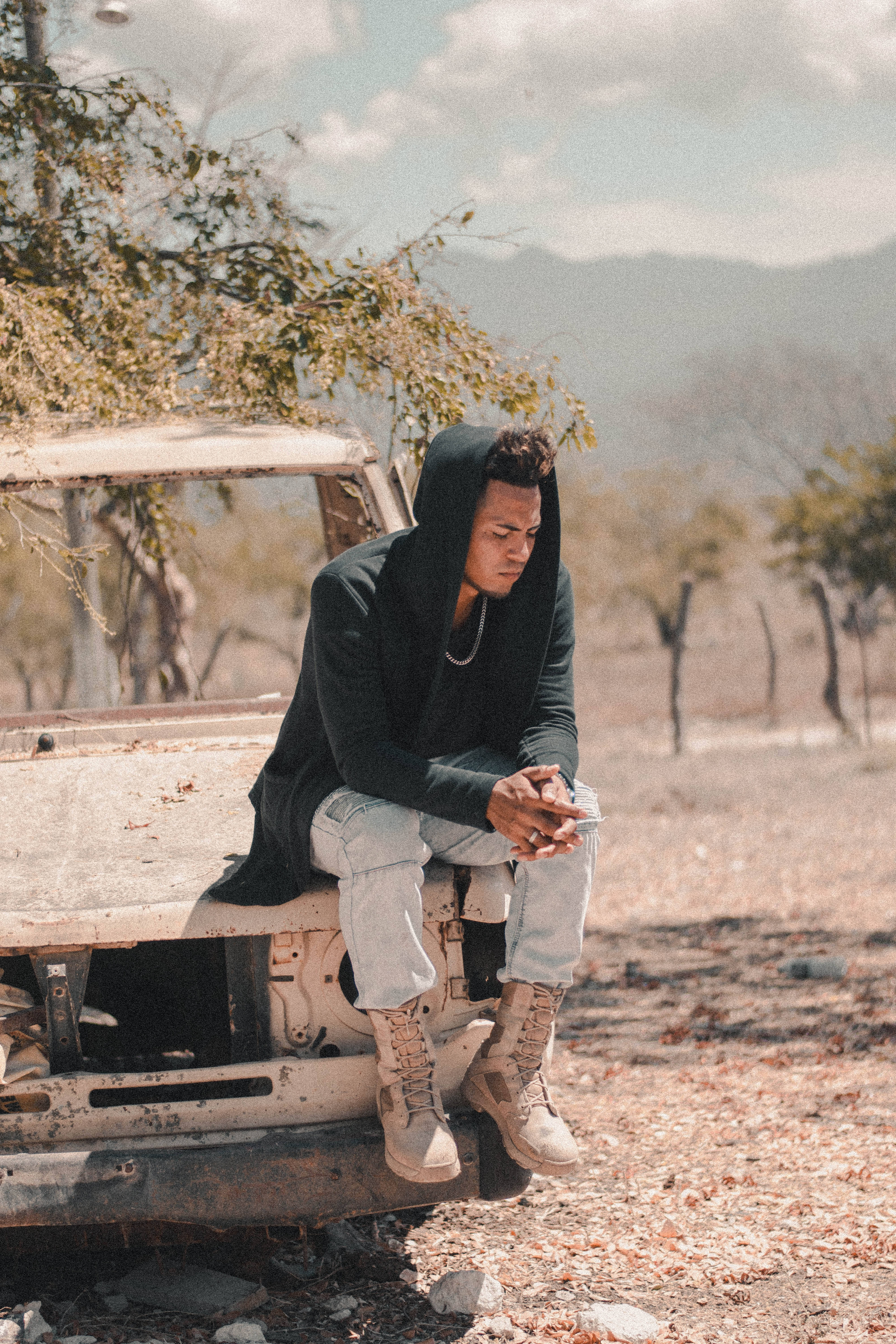 black hoodie, rusted white car, dry tree-dotted field, 5K Phone Wallpaper