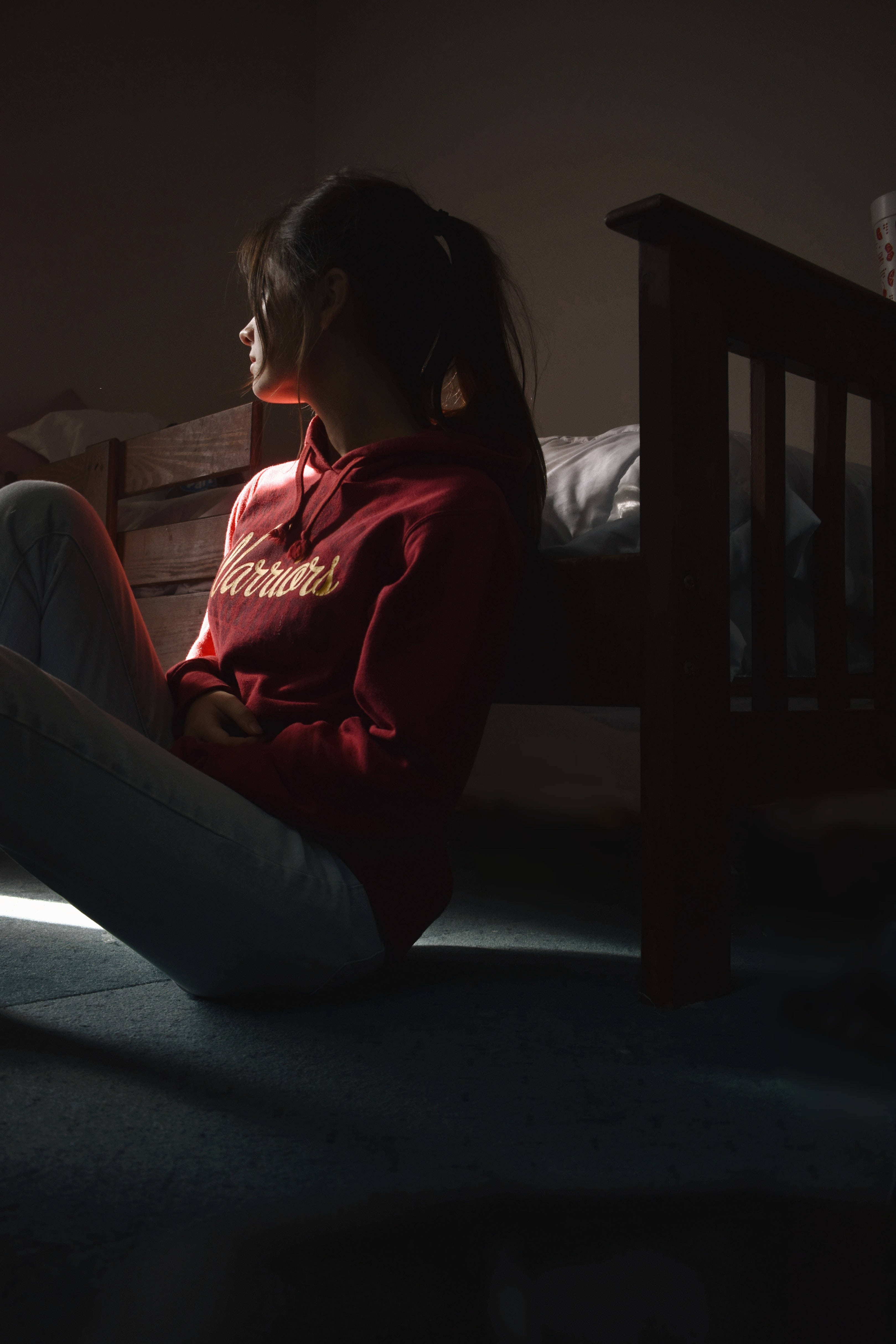 woman, red hoodie, wooden bed, 4K Phone Wallpaper