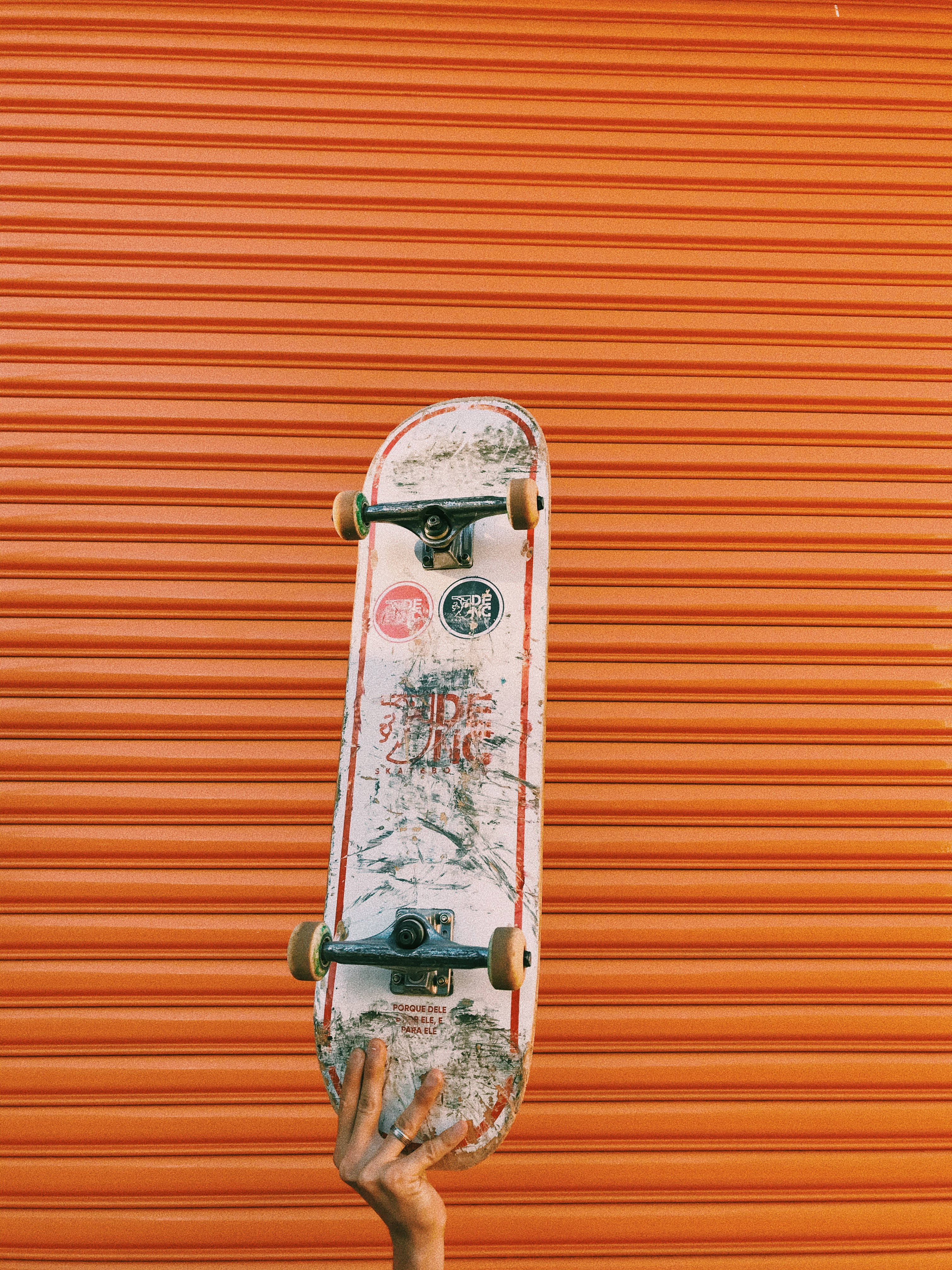 orange gate, weathered skateboard, vibrant orange corrugated metal door, 4K Phone Wallpaper