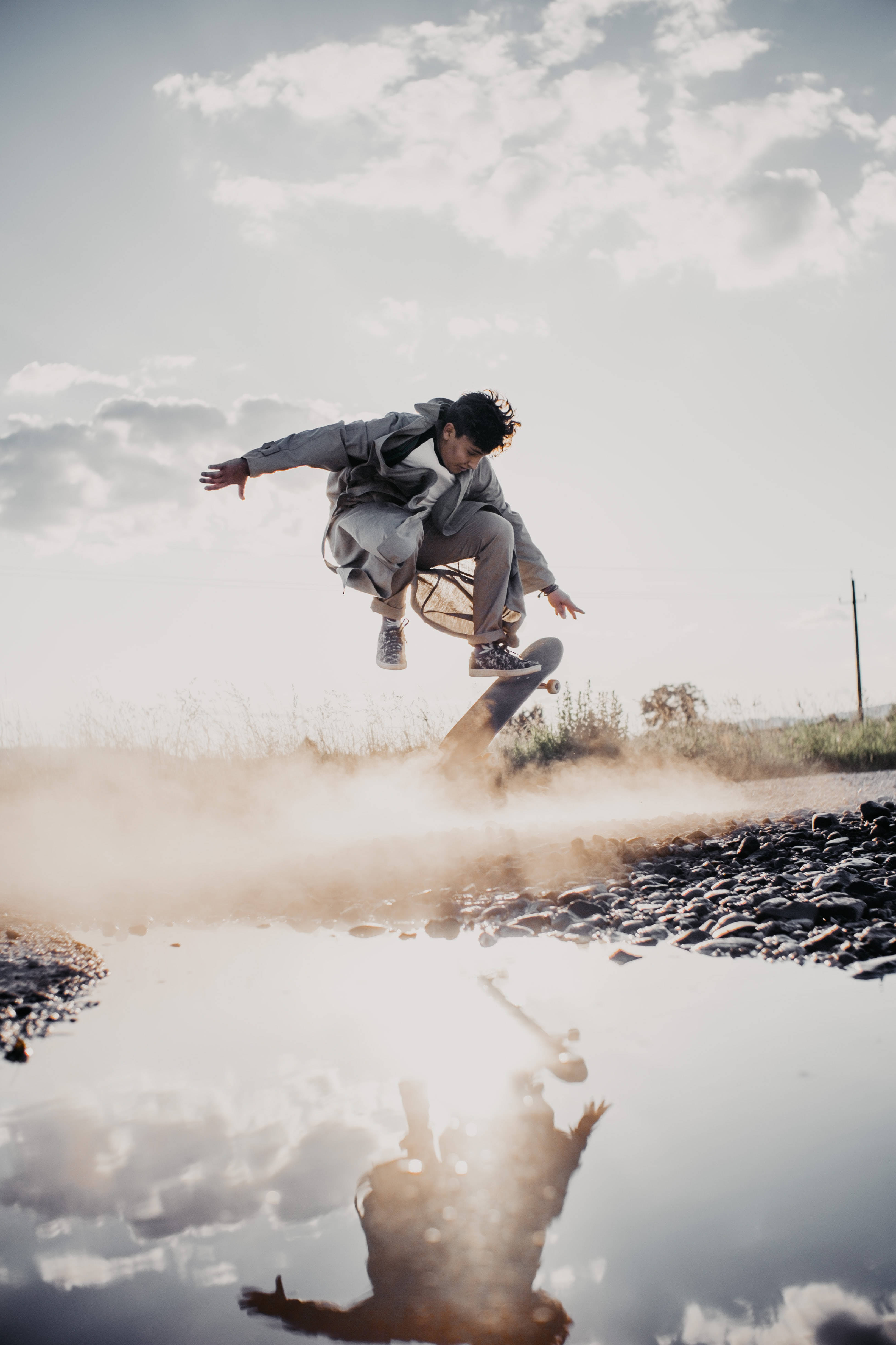 skateboarder, daring stunt, dusty puddle, 4K Phone Wallpaper