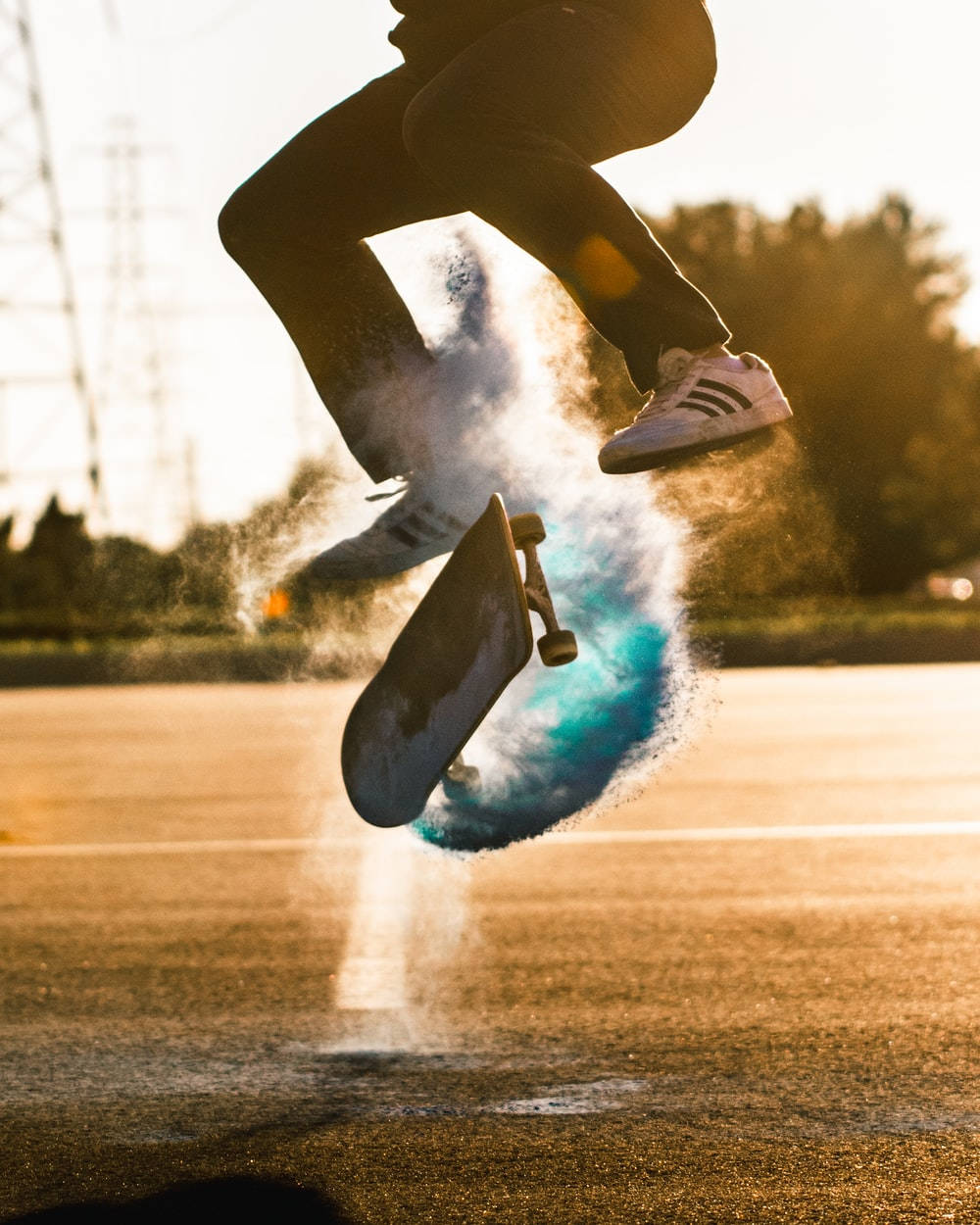 blue powder, golden sunset, skateboarder mid-air, SD Phone Wallpaper
